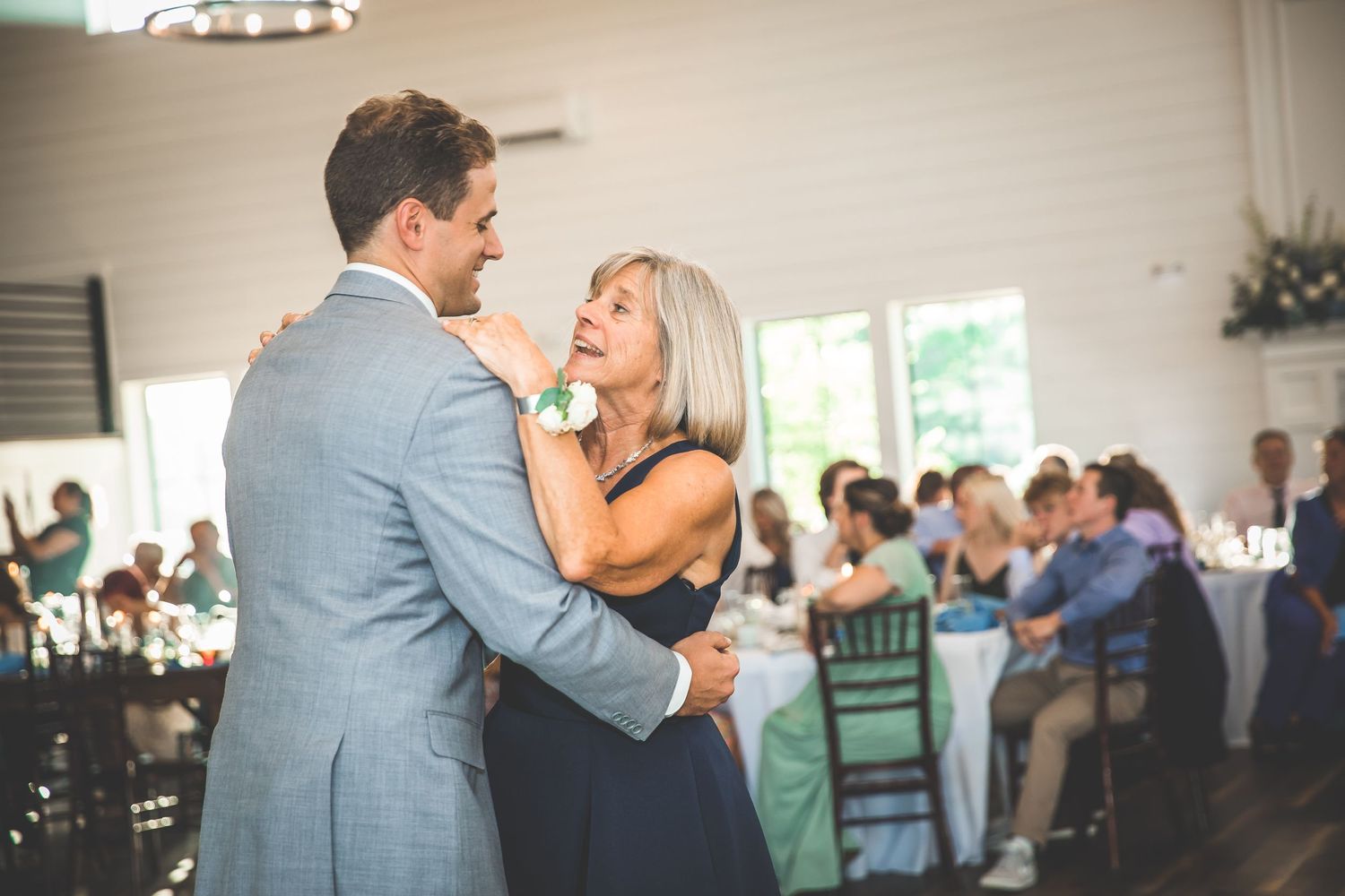 A joyful dance shared between two people at a wedding celebration.