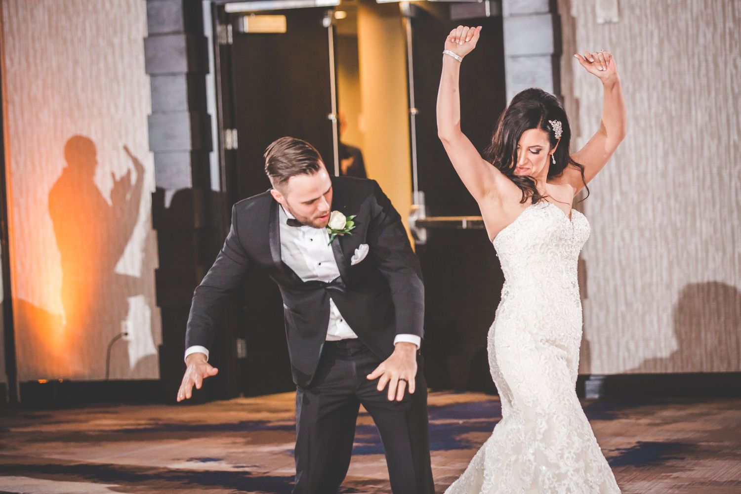 A fun and energetic dance moment captured during a wedding reception.