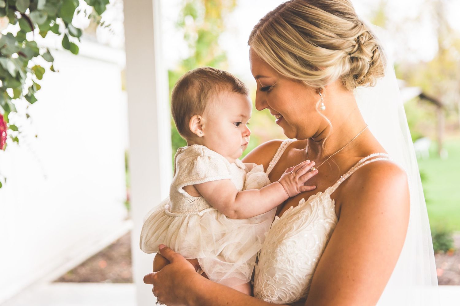 Intimate moment captured between family members during wedding celebration.
