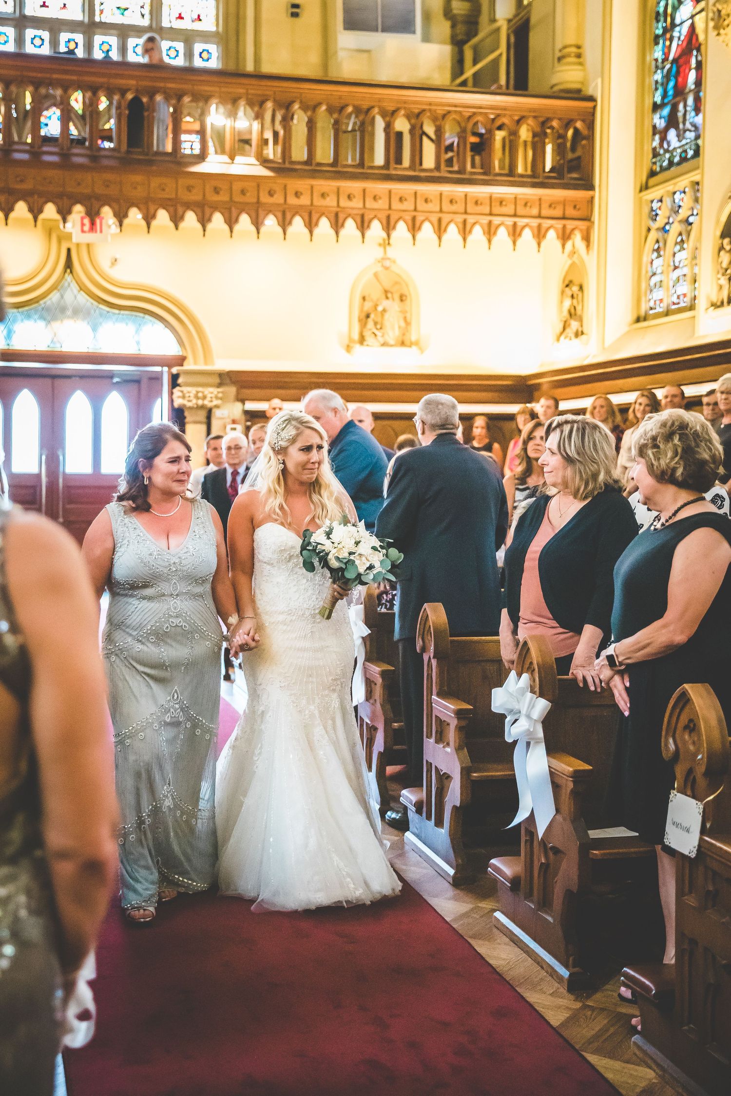 Traditional church wedding ceremony with ornate architecture and stained glass windows.