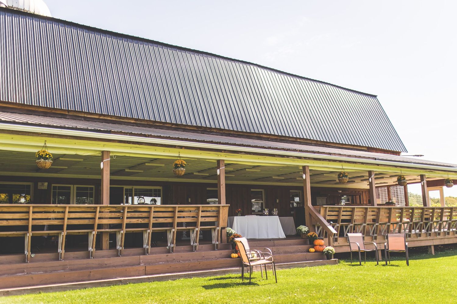 Modern architectural exterior of a long horizontal building with clean lines and extended roof overhangs.