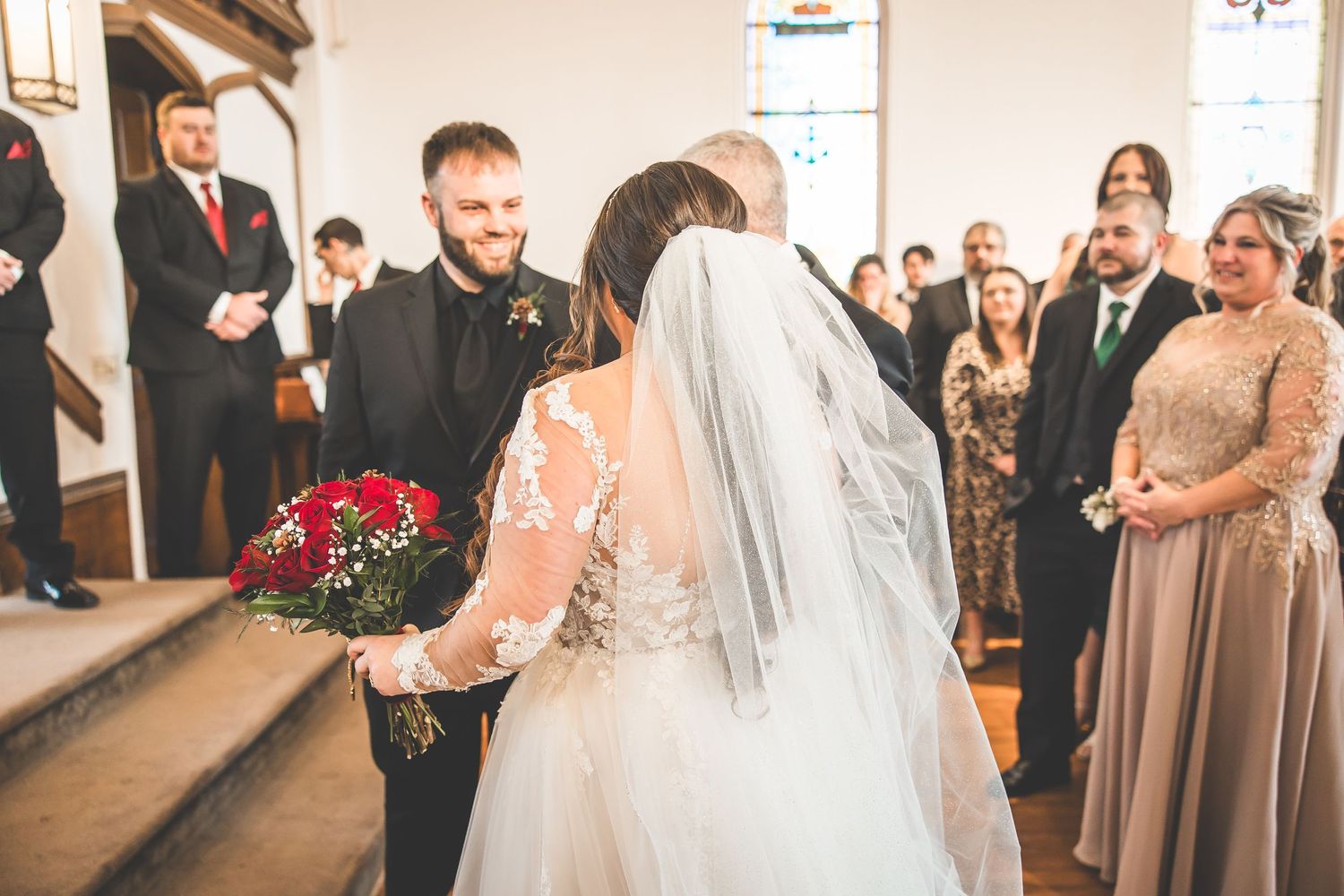 Traditional church wedding ceremony with guests watching the proceedings.