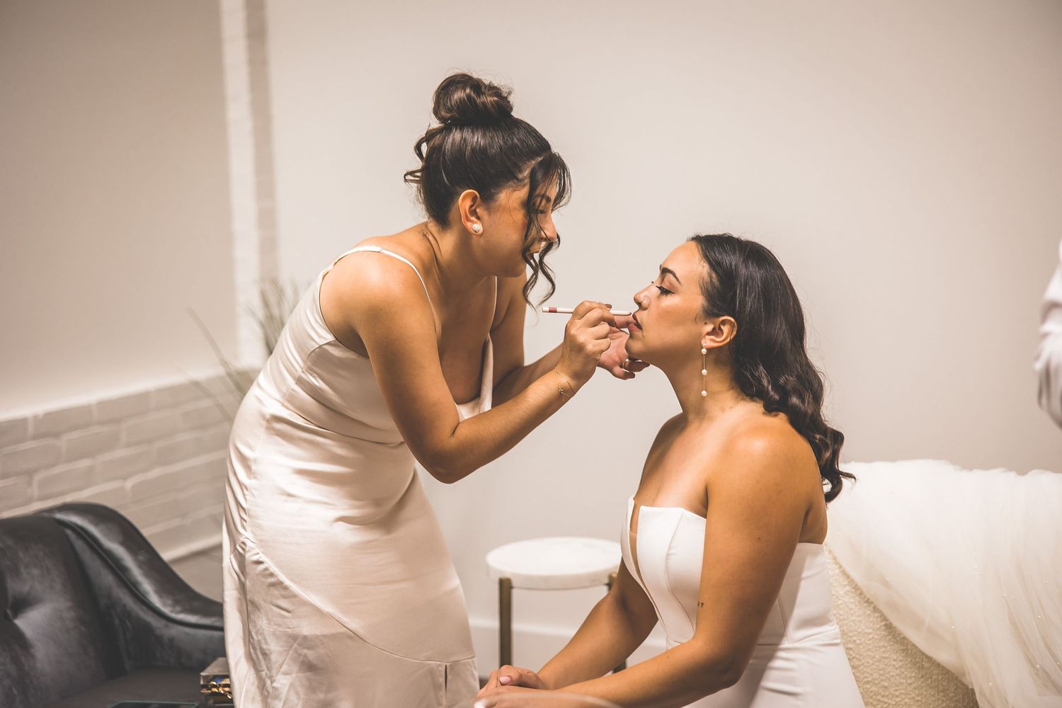Candid wedding moments captured in a series of black and white photographs.