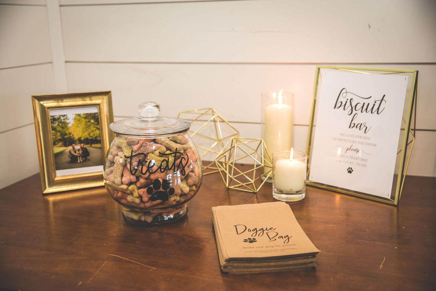 Wedding reception detail shots of signage and decorative elements on wooden table.