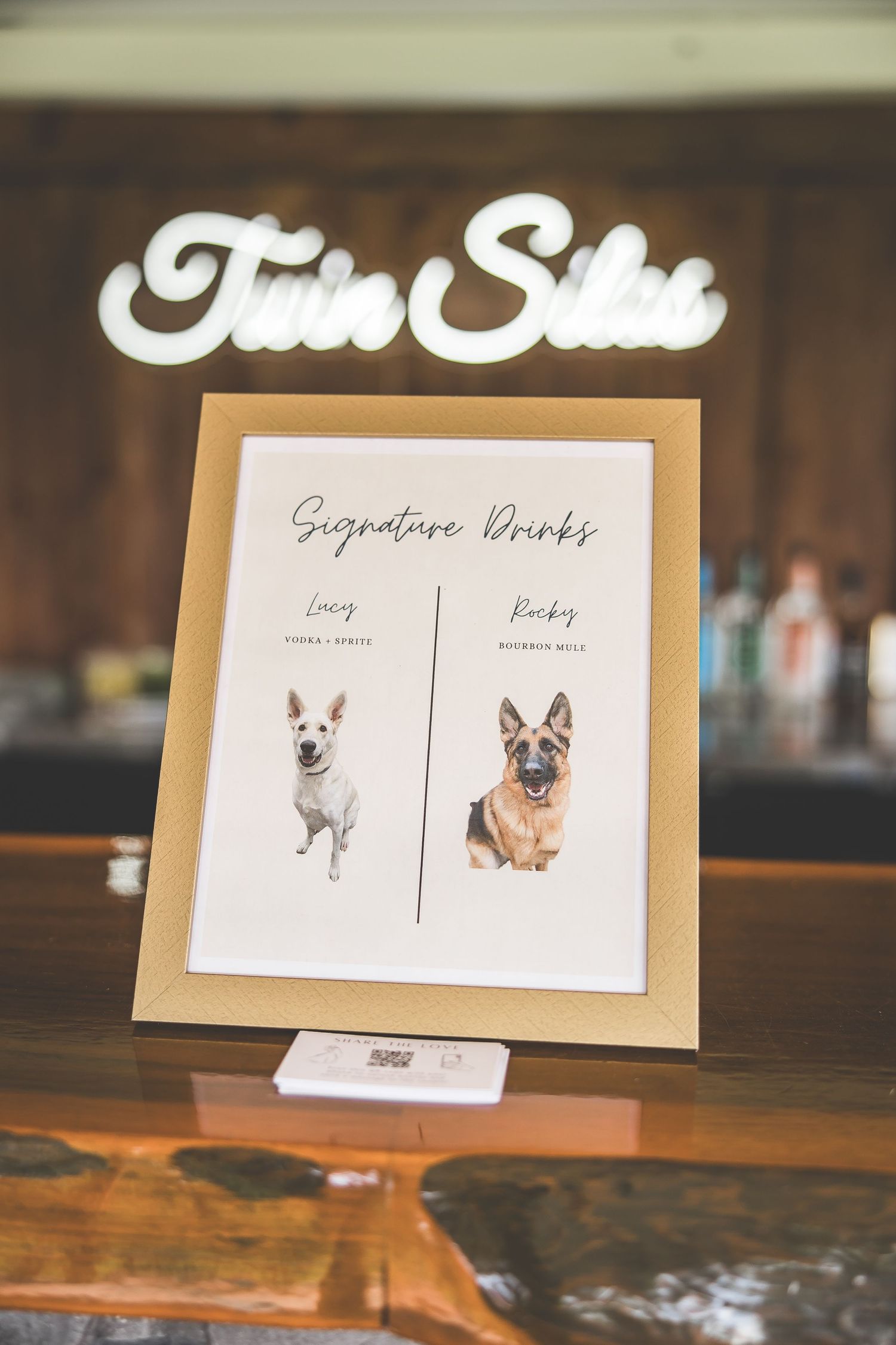 Wedding signature drink menu cards featuring cute illustrated dogs on wooden table.