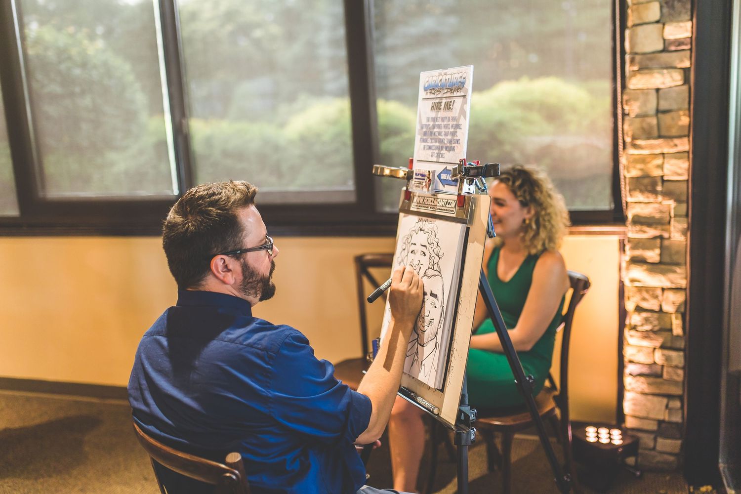 A couple reviews their seating chart board at a rustic-styled wedding venue.