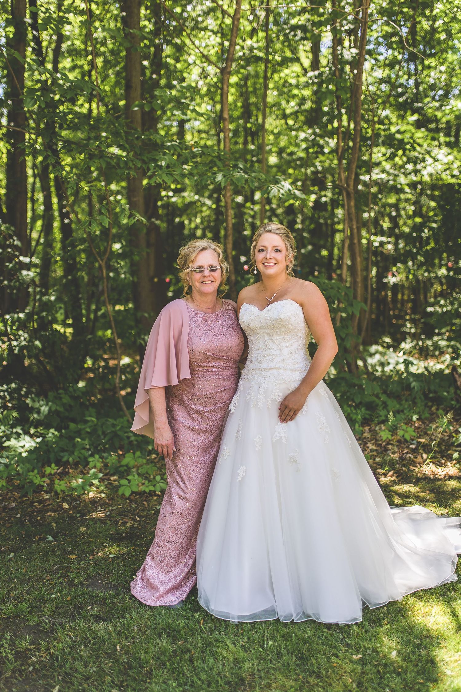 Outdoor forest portrait with elegant formal attire.