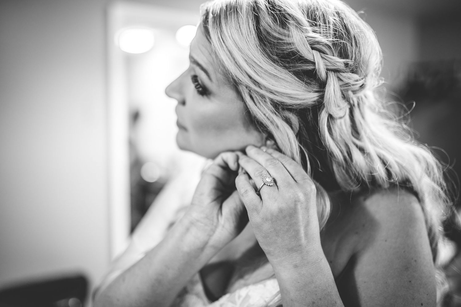 Black and white portrait showing wedding day preparation moments and emotional expressions.