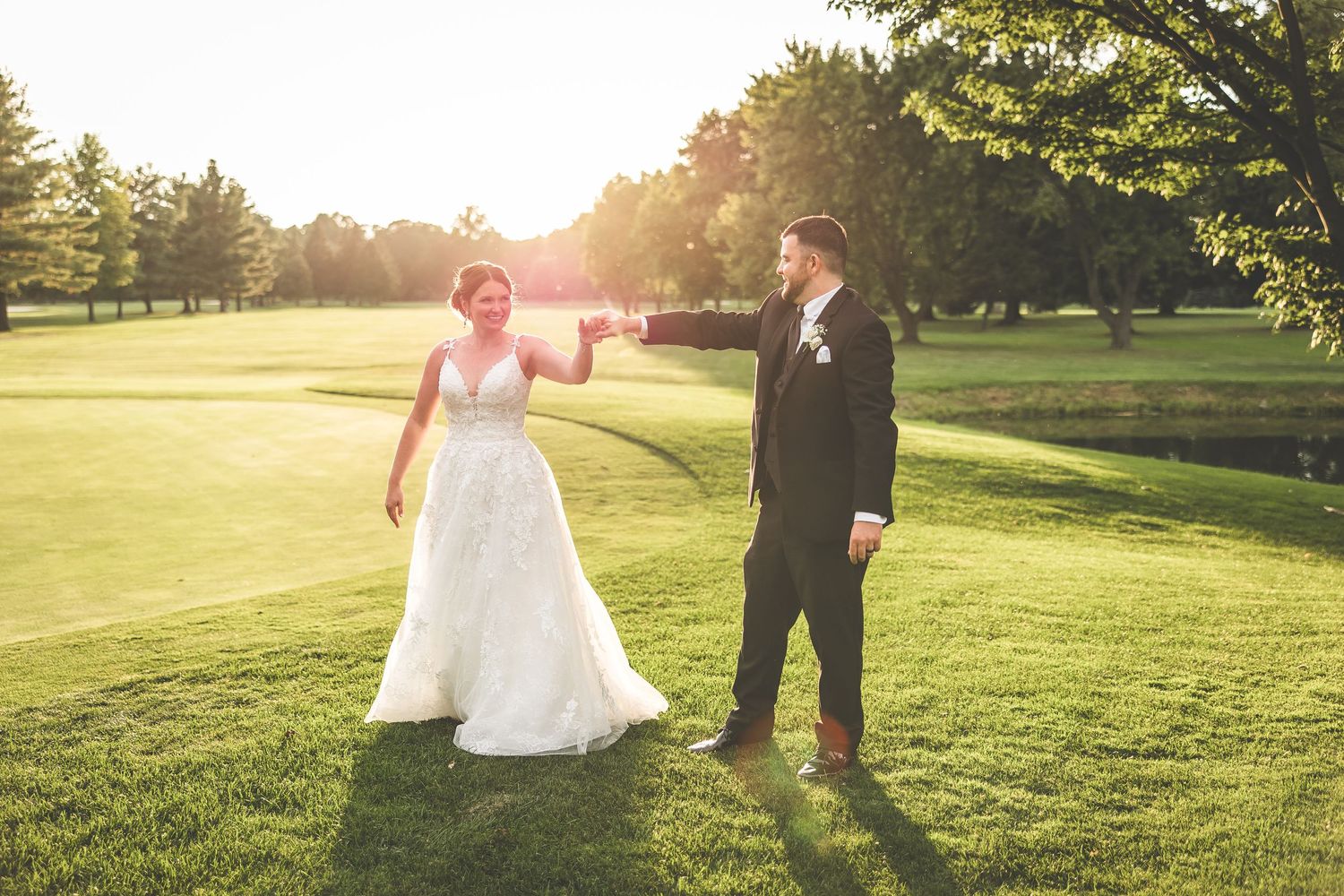 Sunset wedding photography on a lush green golf course.