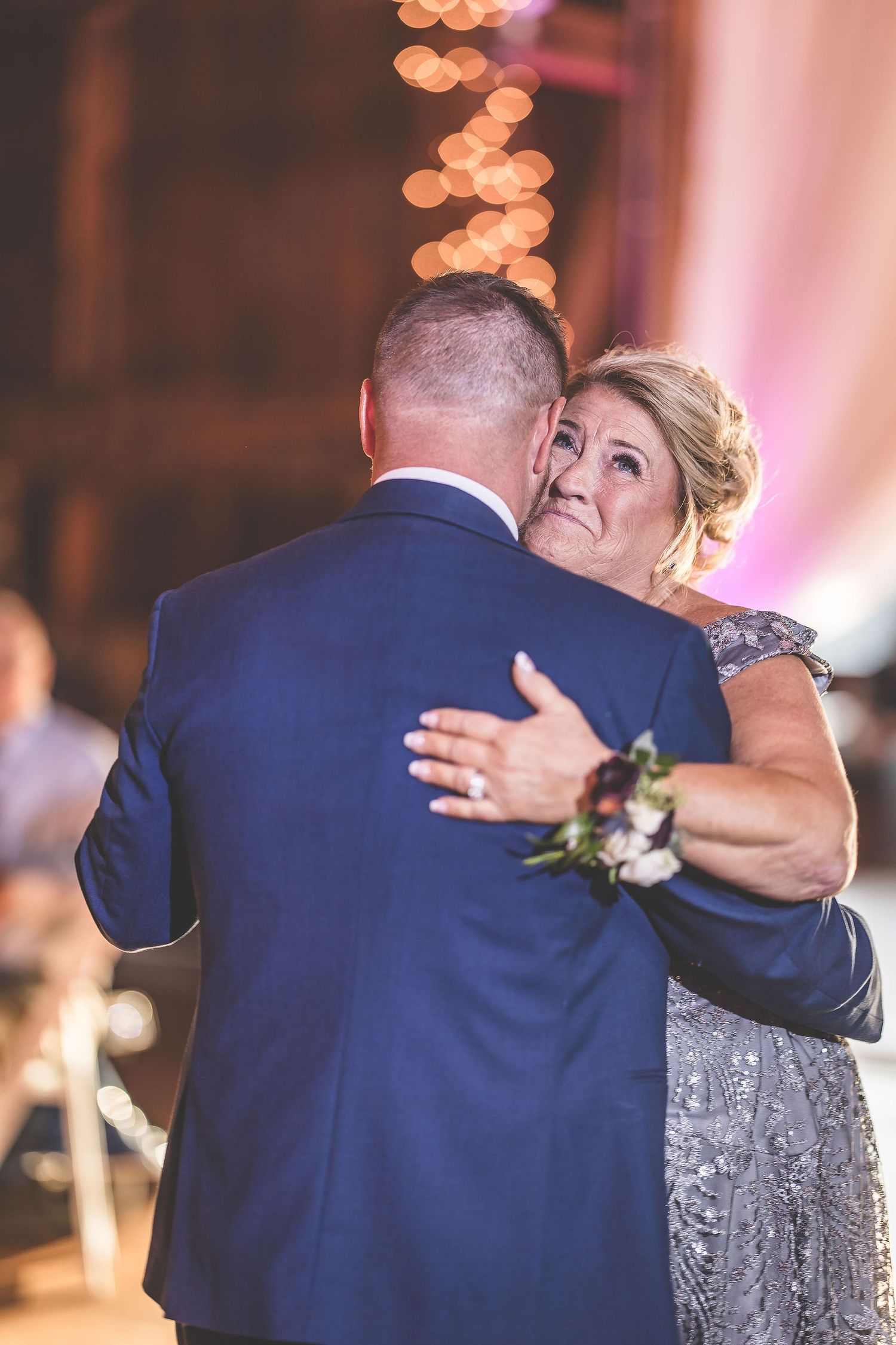 Intimate dance captured in sequence showing tender moments between wedding guests.