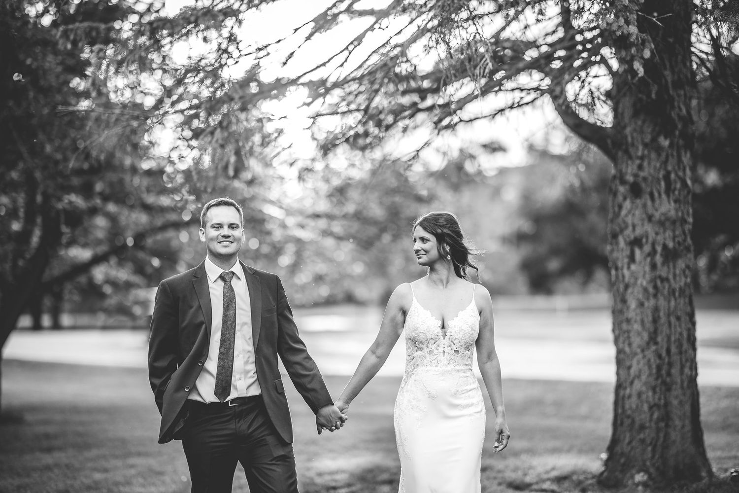 Wedding couple shares tender moments during outdoor photo session.