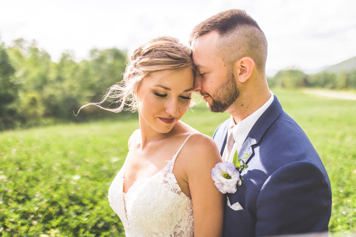Romantic wedding portraits showing tender moments between newlyweds in golden sunlight.