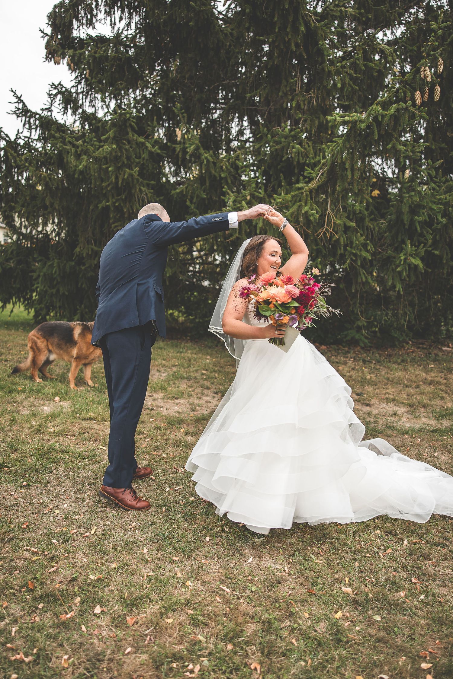 A playful wedding photoshoot sequence with the couple dancing and twirling outdoors.