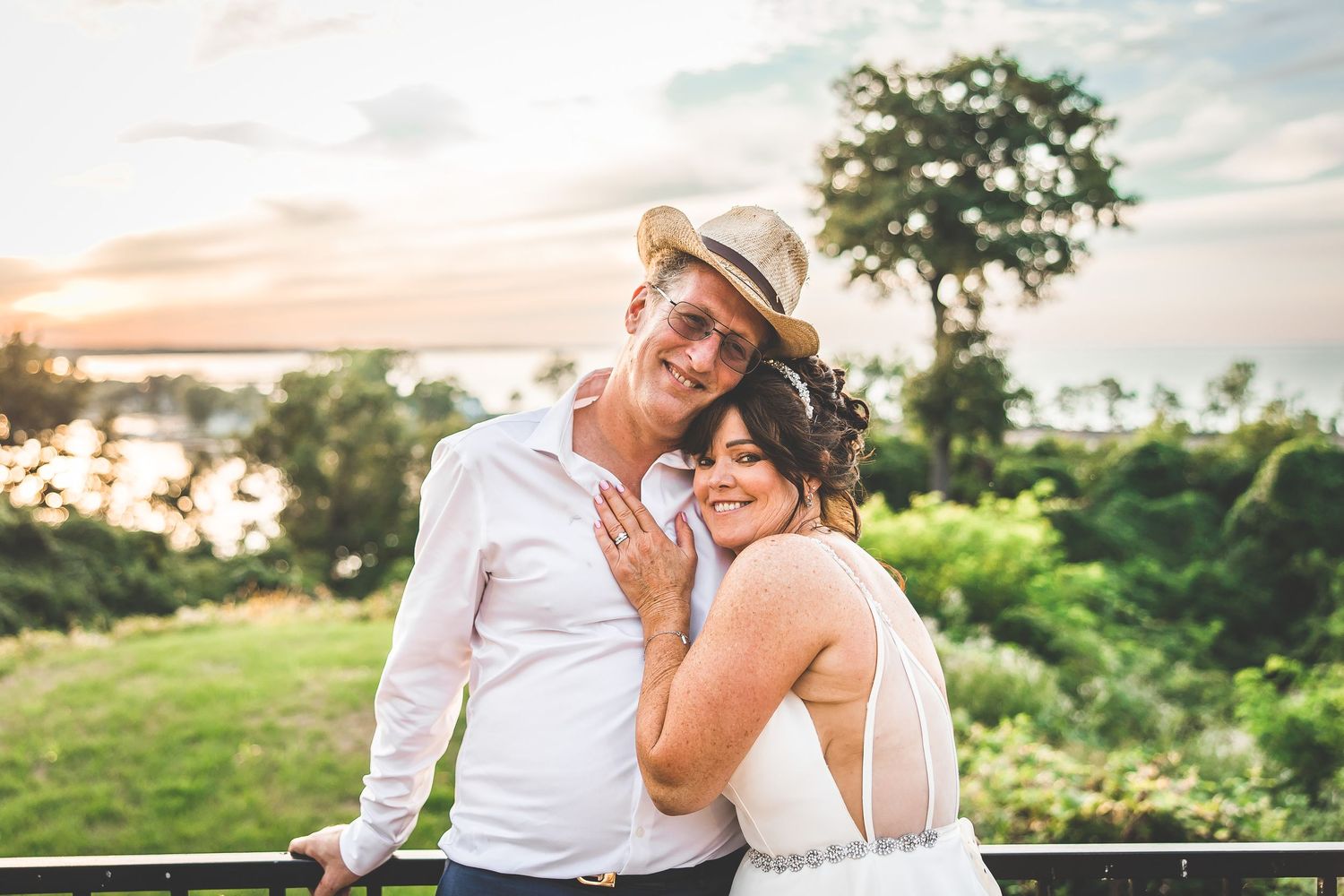 A romantic sunset wedding photoshoot in a lush garden setting with soft golden light.