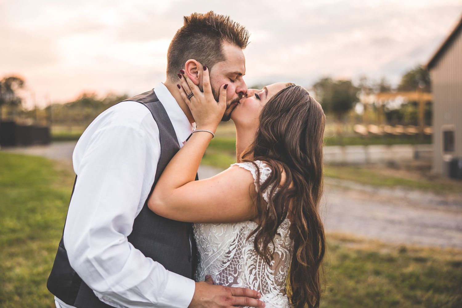 Romantic sunset wedding portraits showing tender moments between newlyweds.