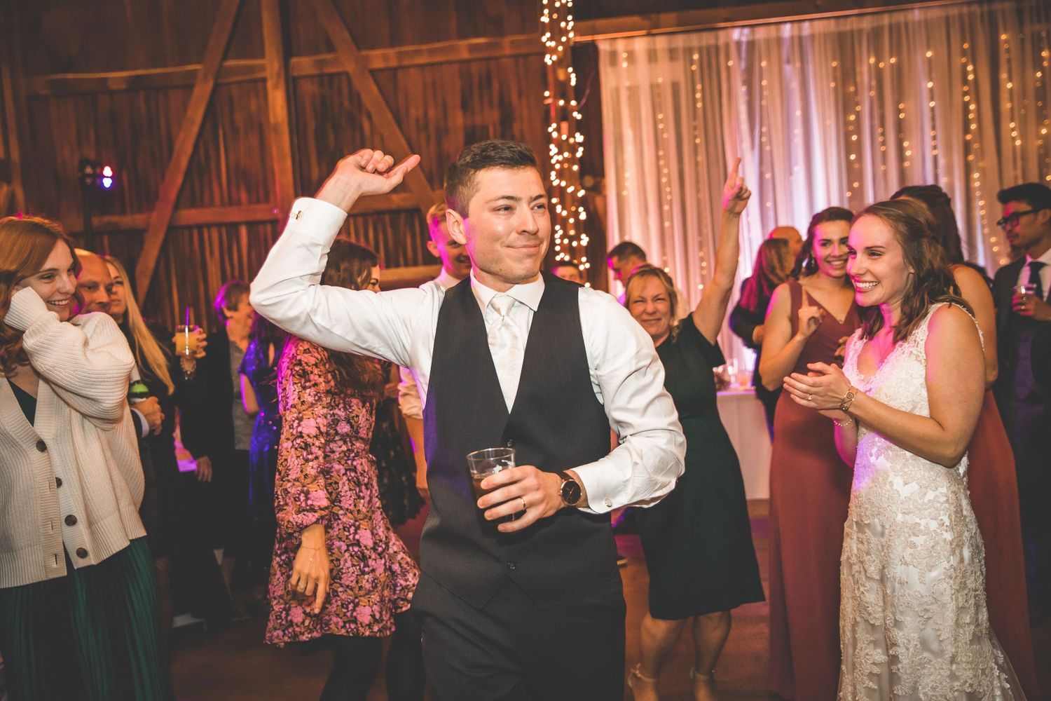 Wedding reception dance floor filled with guests enjoying the celebration.