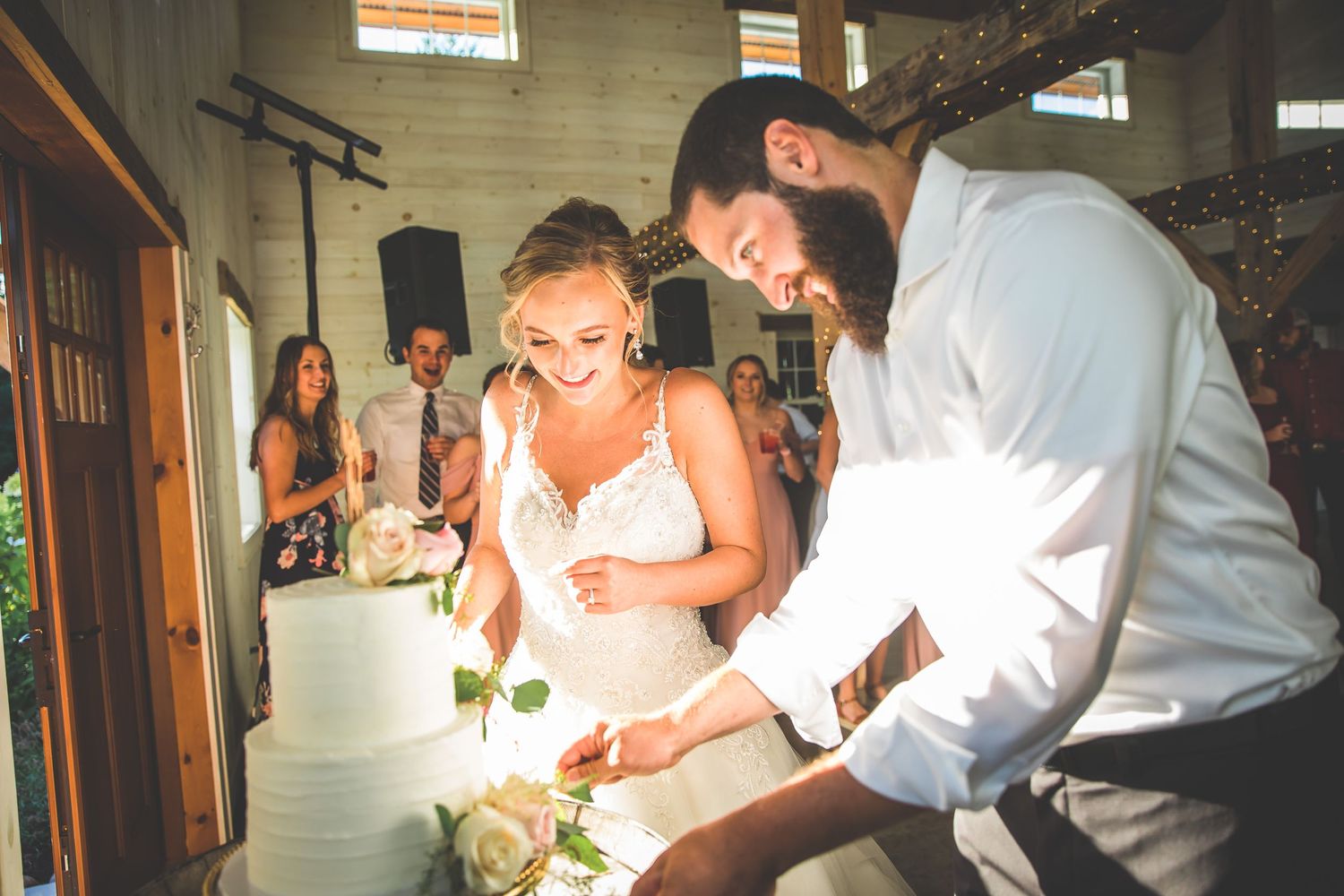 Candid moments from wedding reception showing guests dancing and celebrating.