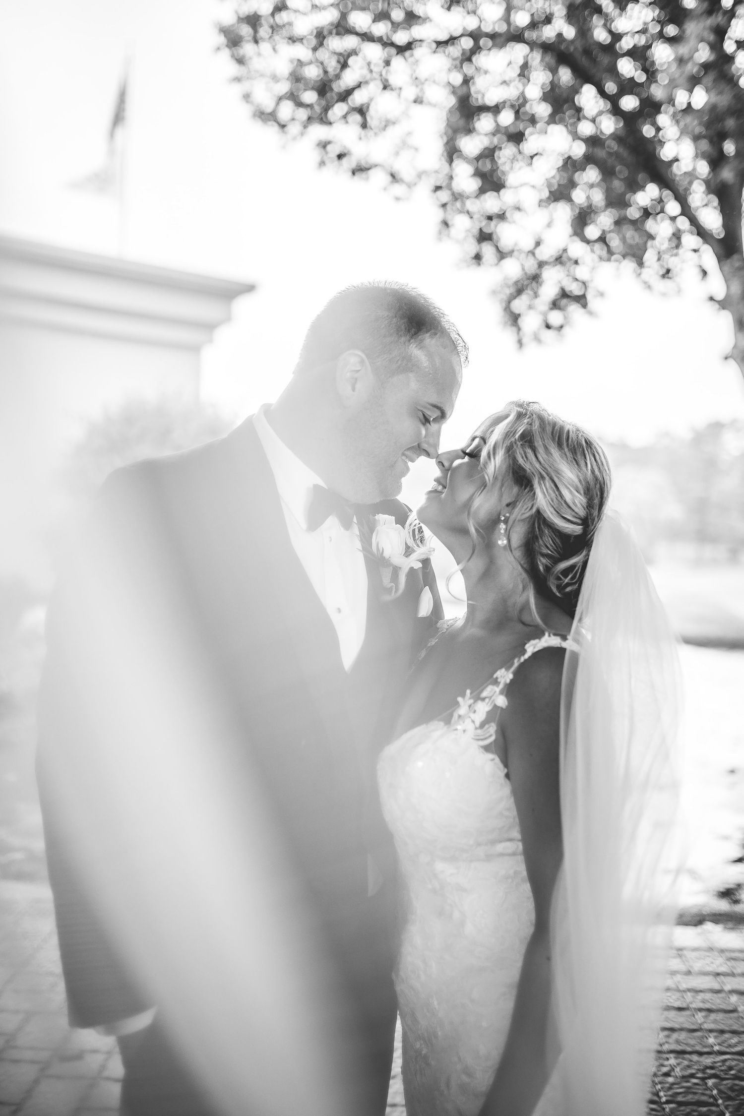 Romantic black and white wedding photo sequence showing intimate moments in natural lighting.