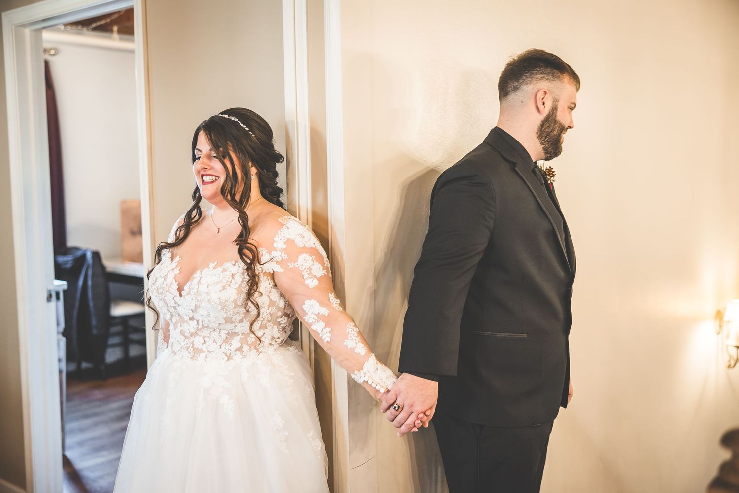 First look moment between couple in formal wedding attire.