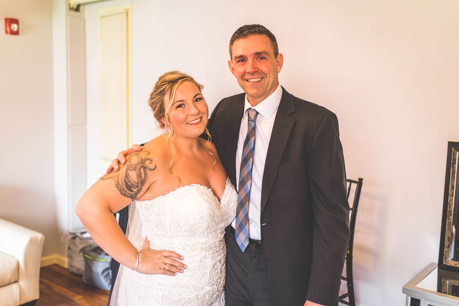 Tender moment shared during wedding day preparations.