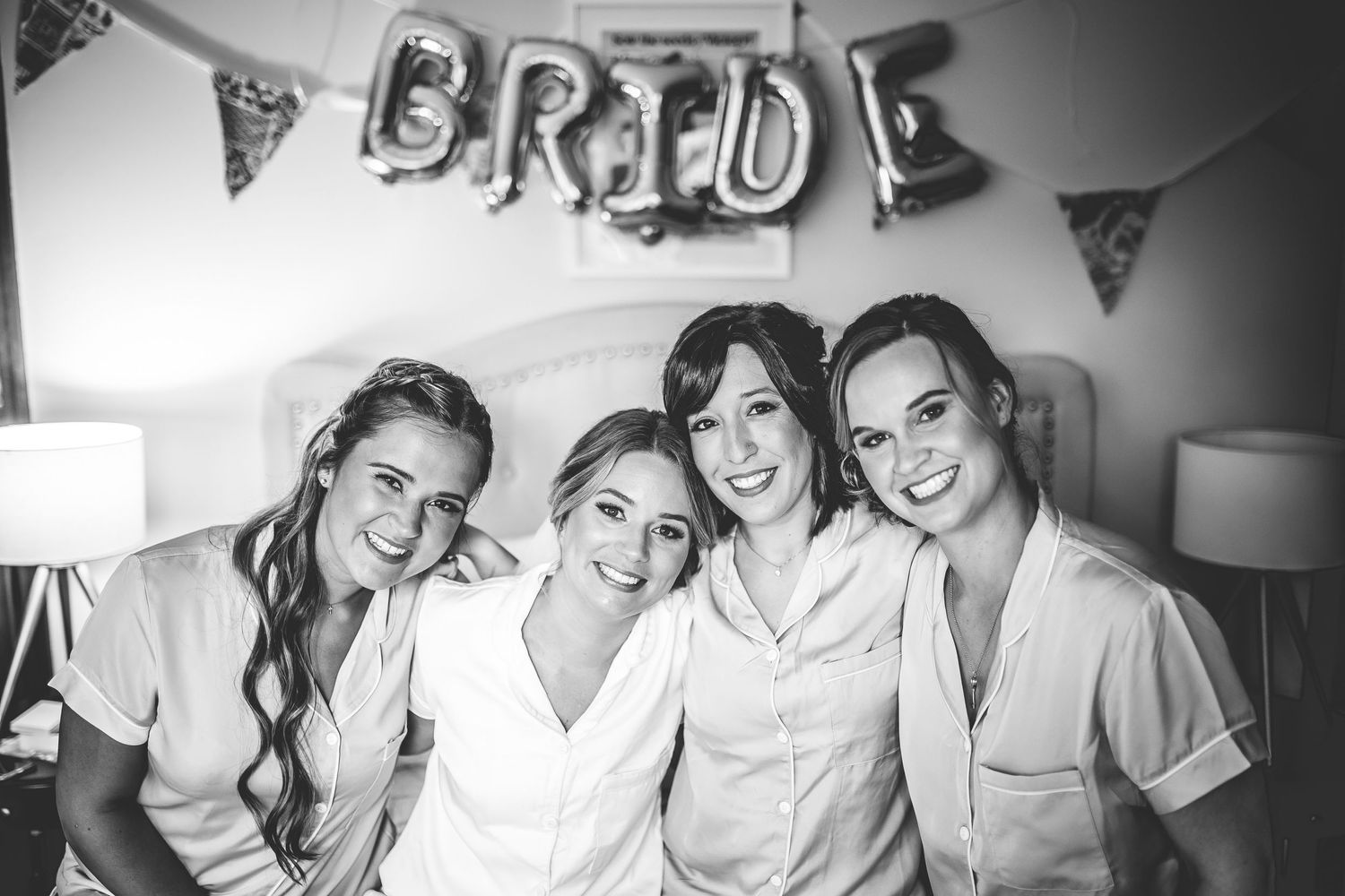 Black and white photo of wedding party preparations.