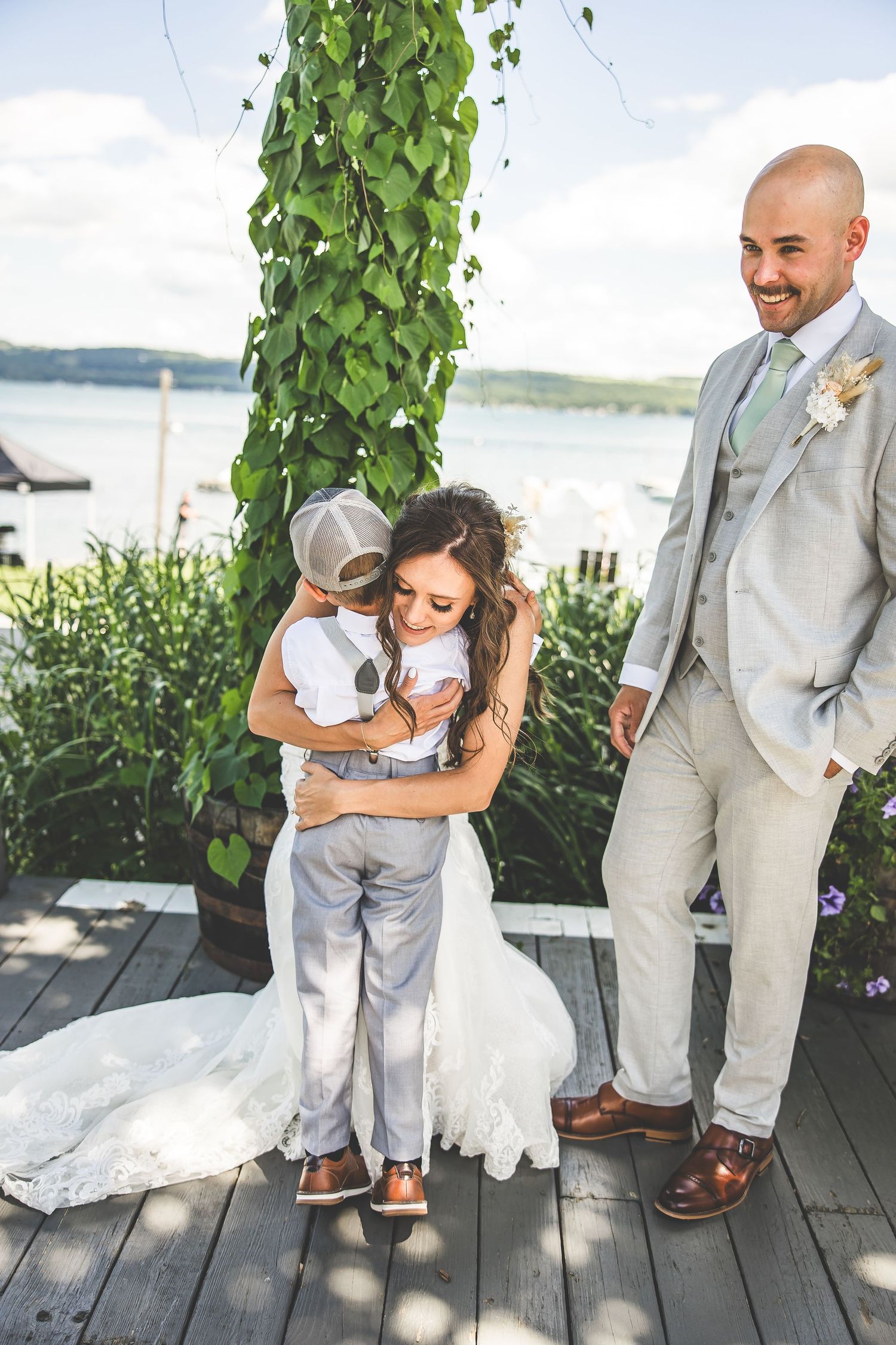 A series of candid wedding moments captured on a wooden deck by the water.