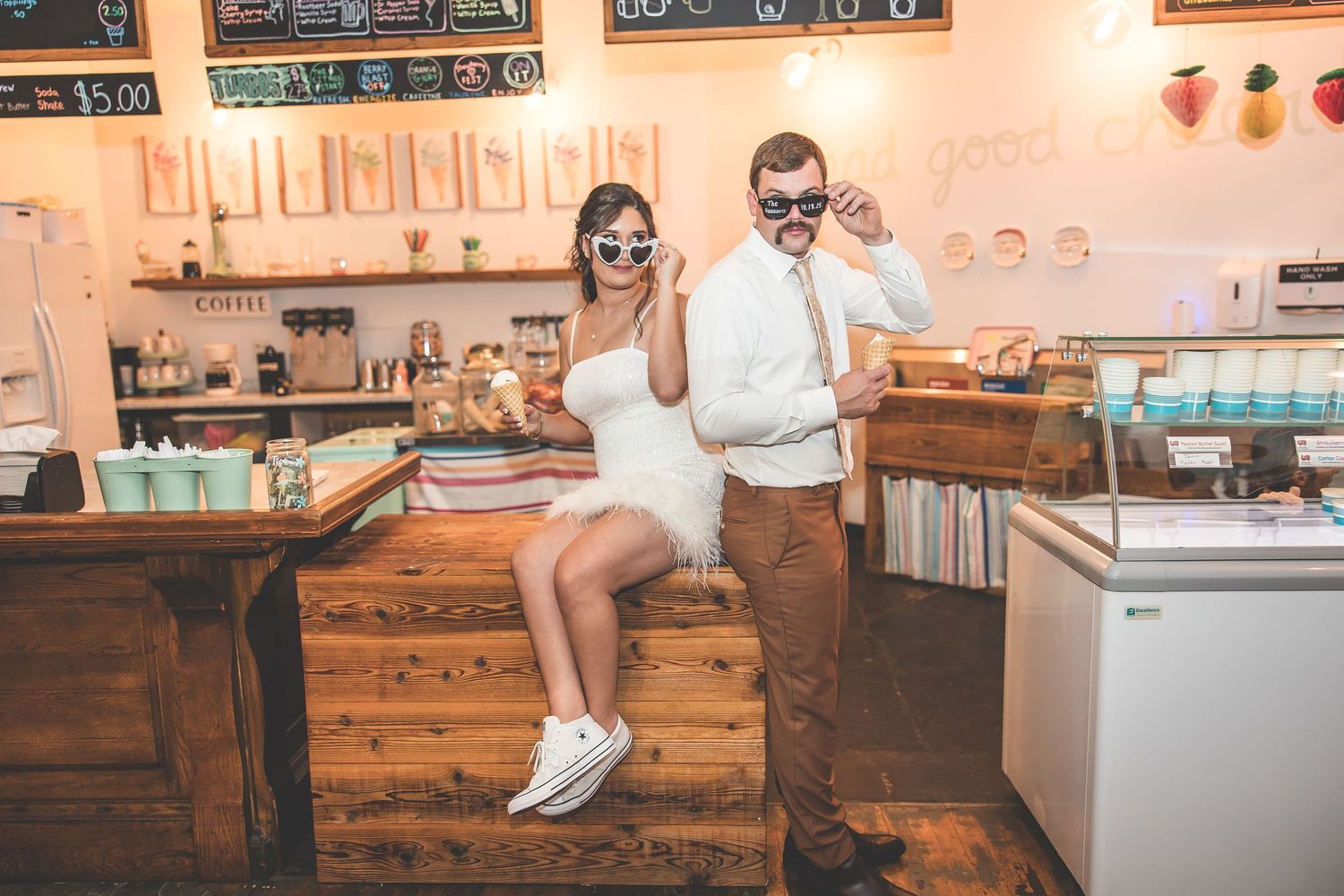 Fun engagement session in a retro-styled coffee shop with wooden furnishings.