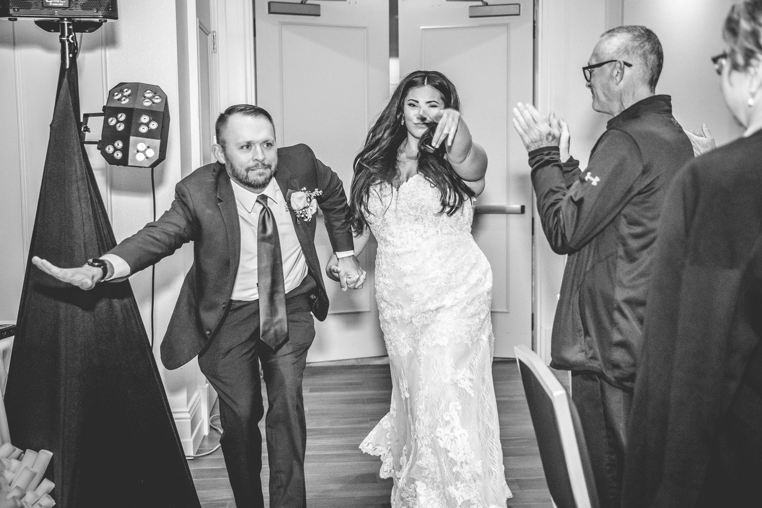 Wedding celebration candid moments captured in black and white photography.