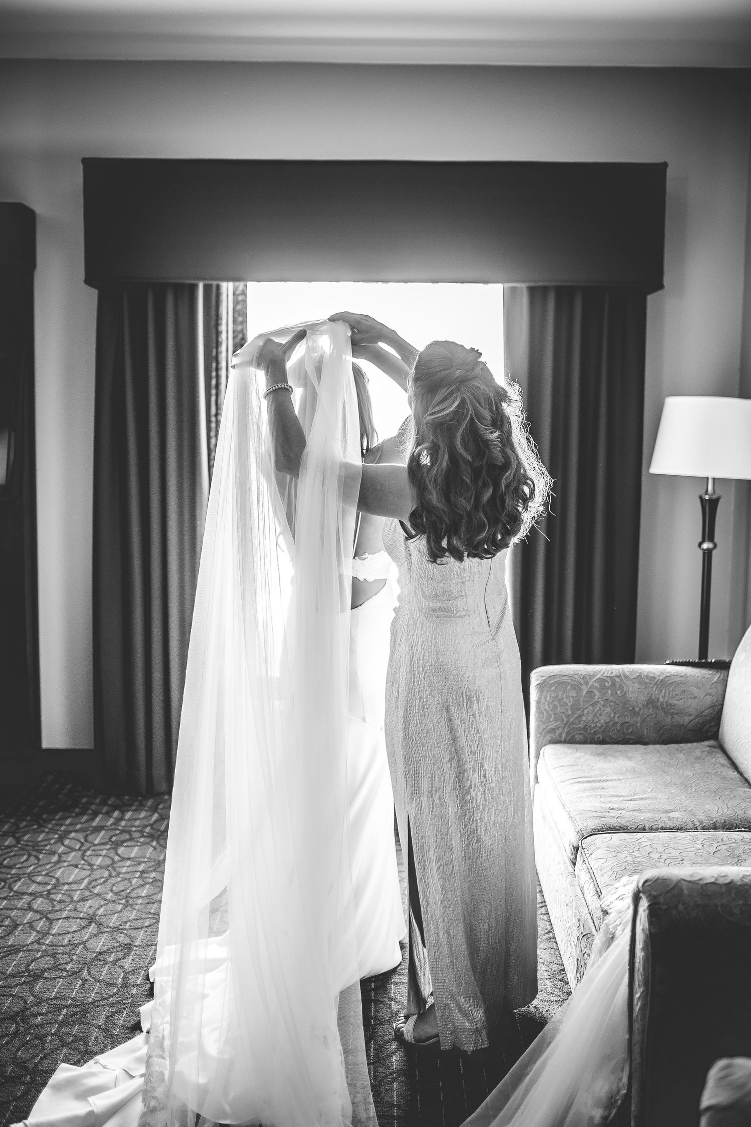 Dramatic black and white shots of wedding dress and final preparation moments.