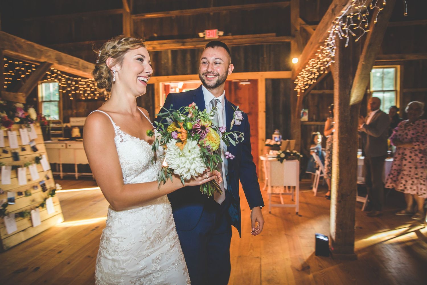 Romantic barn wedding reception with string lights creating a warm ambiance.
