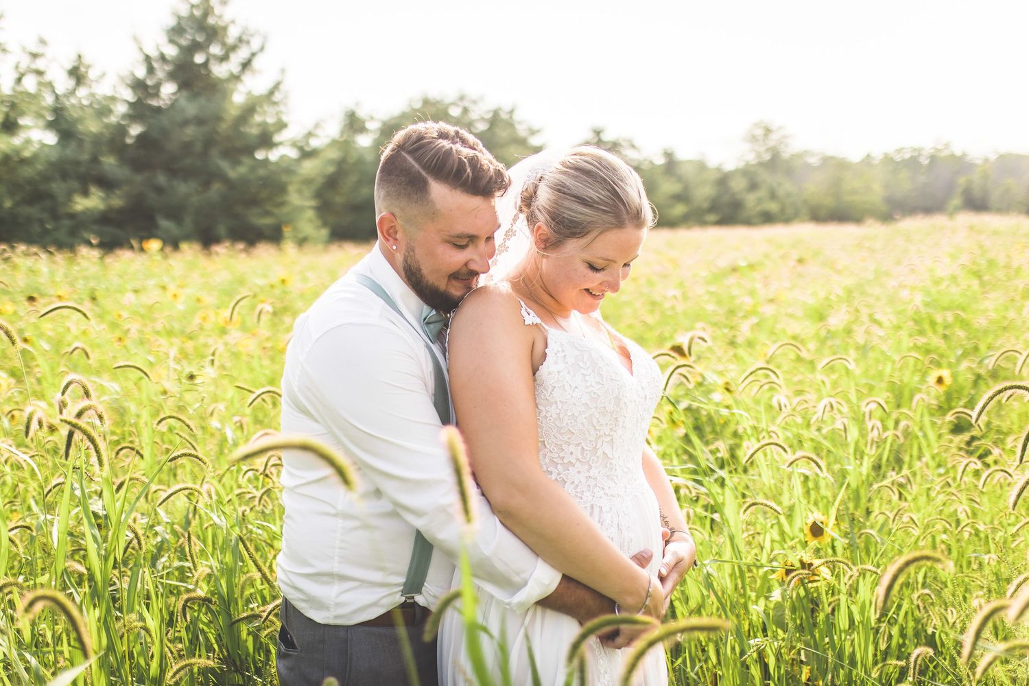 Romantic couple photos captured in a sunlit field during golden hour.