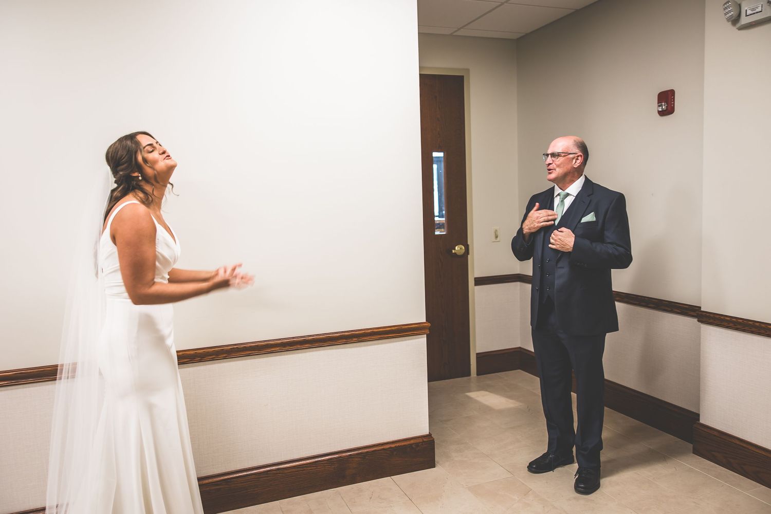A series of candid moments captured in a church hallway during a wedding celebration.