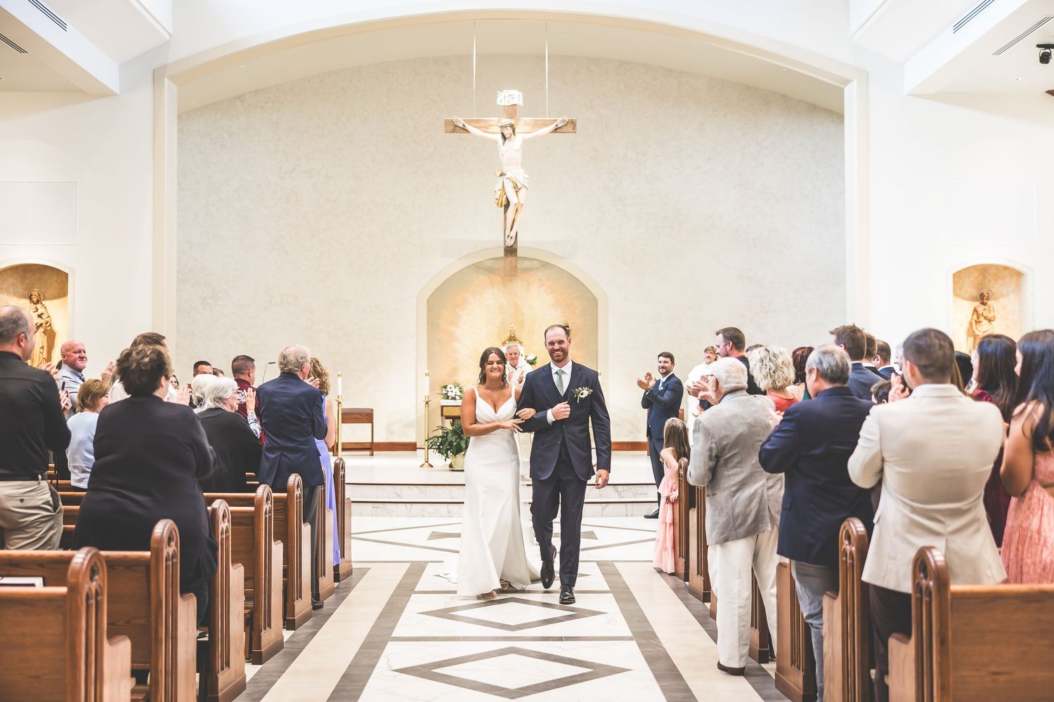 Multiple angles of a church wedding ceremony showing guests seated in wooden pews.