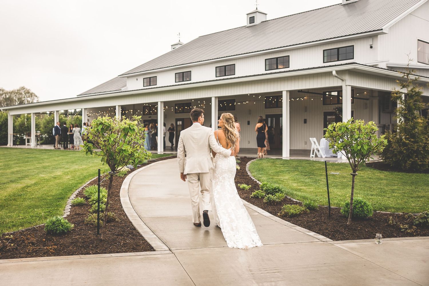 Wedding venue exterior showing curved pathway and landscaped gardens.