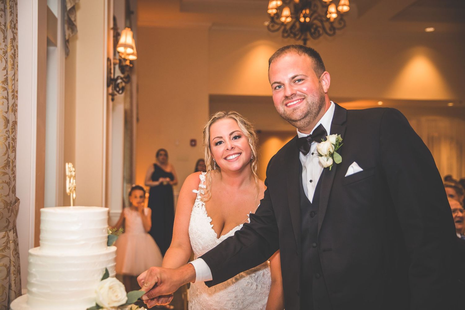 Wedding celebration candid moments captured in an elegant ballroom setting.