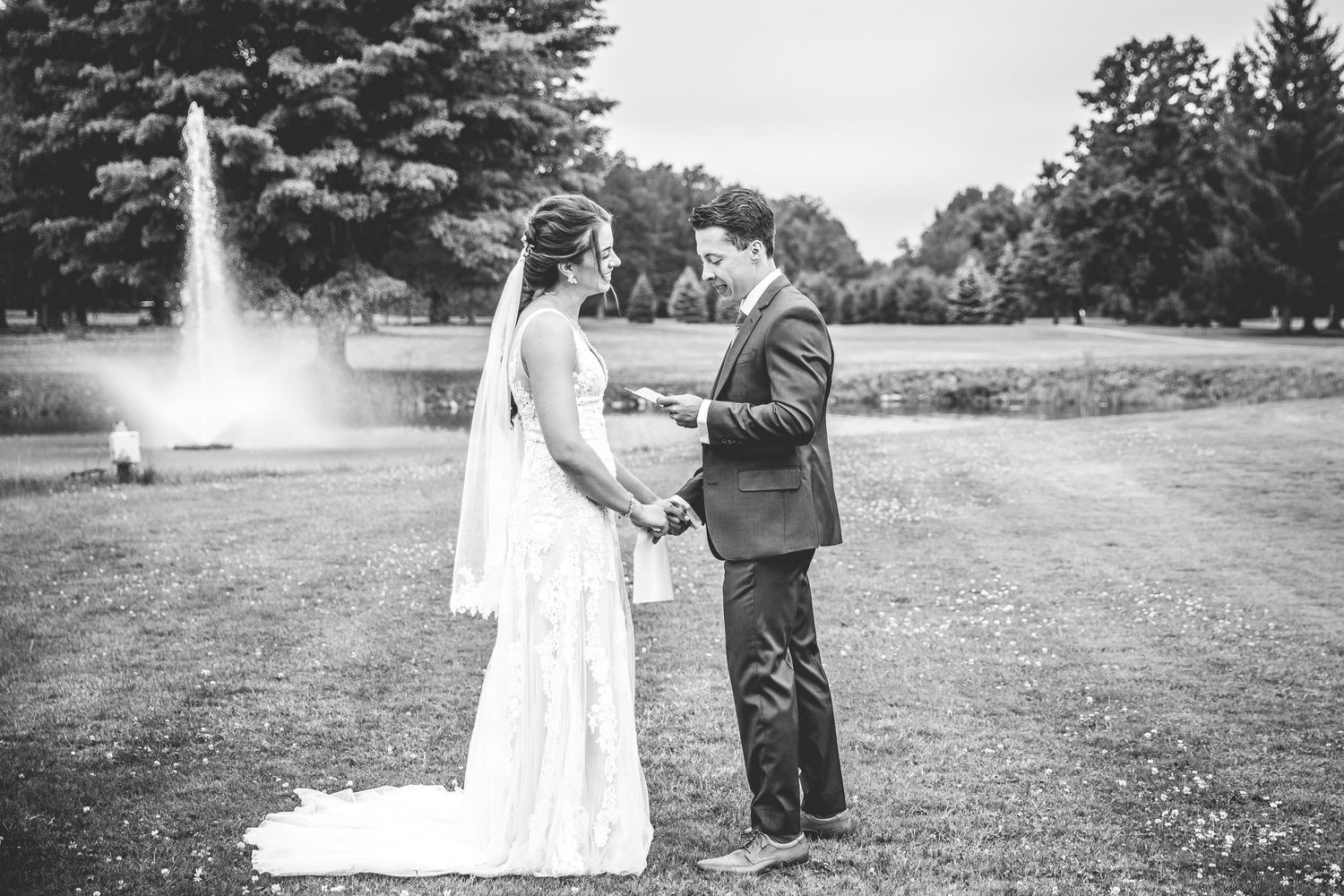 A series of romantic wedding moments captured in black and white showing a couple in an outdoor garden setting.
