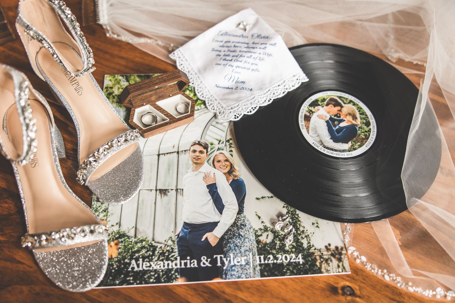 Close-up shots of hands holding vintage vinyl records at a wedding reception.