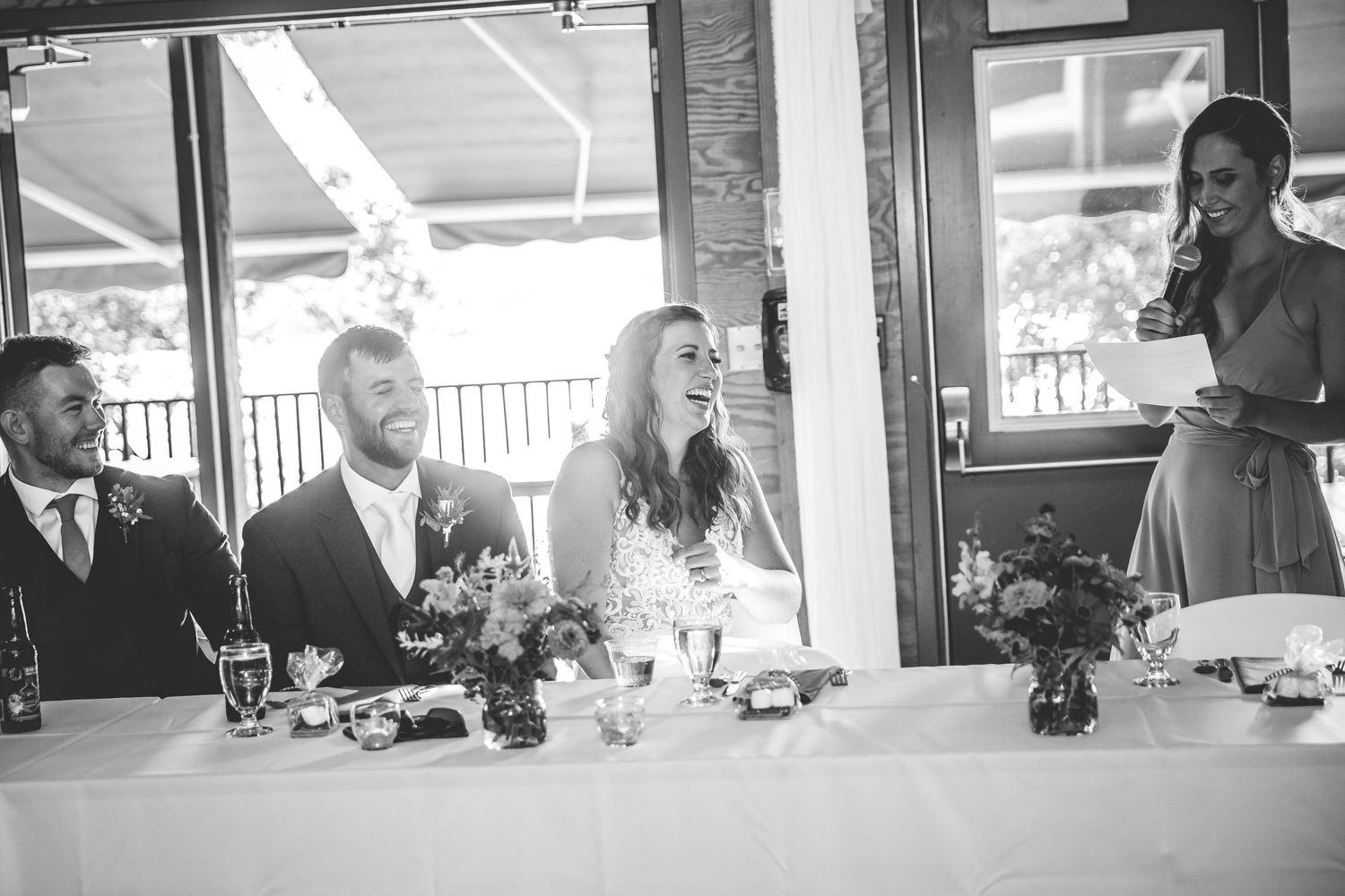 Bright reception space with large windows and natural lighting illuminating the dining area.