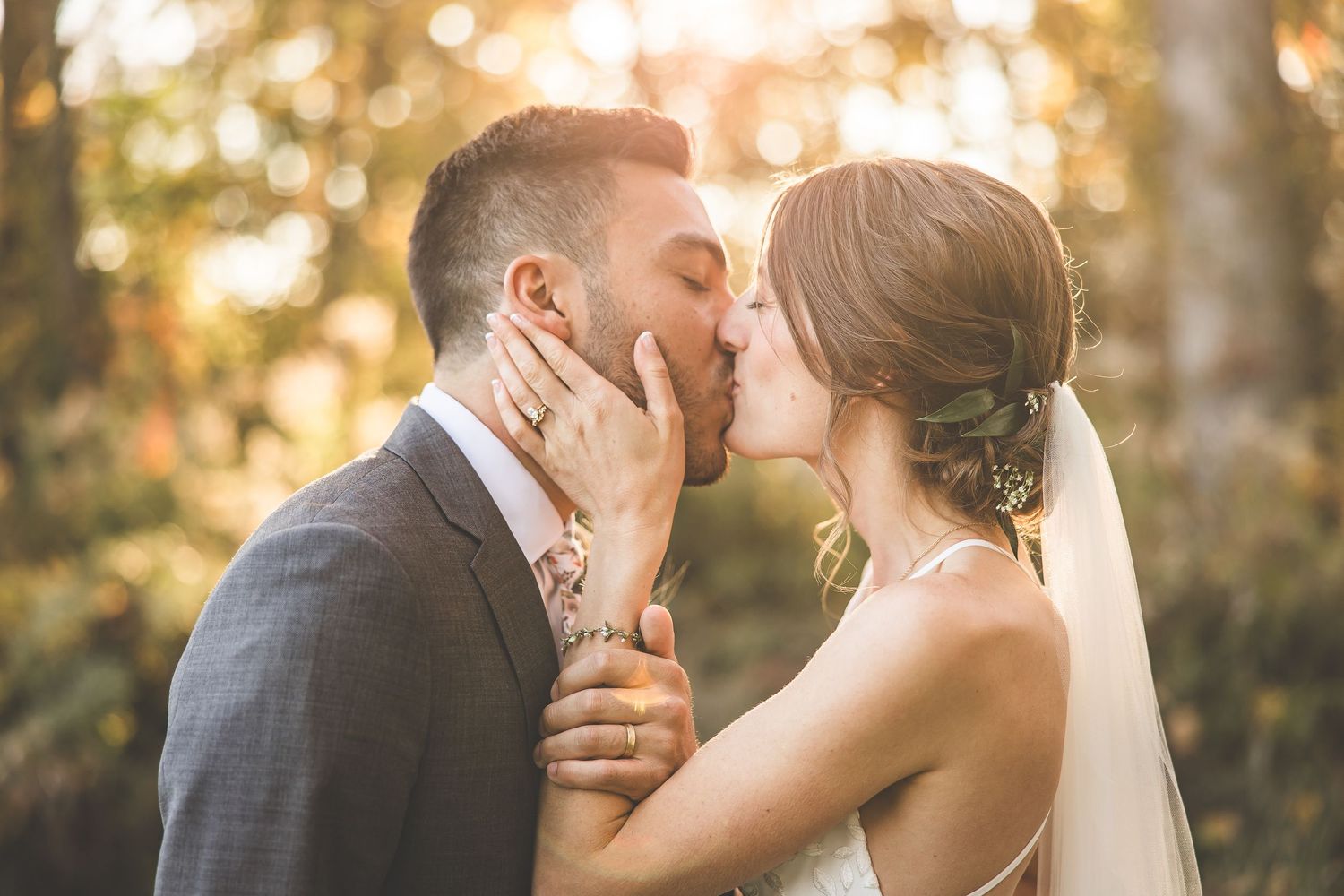 A romantic sunset wedding photoshoot showing tender moments between newlyweds in golden light.