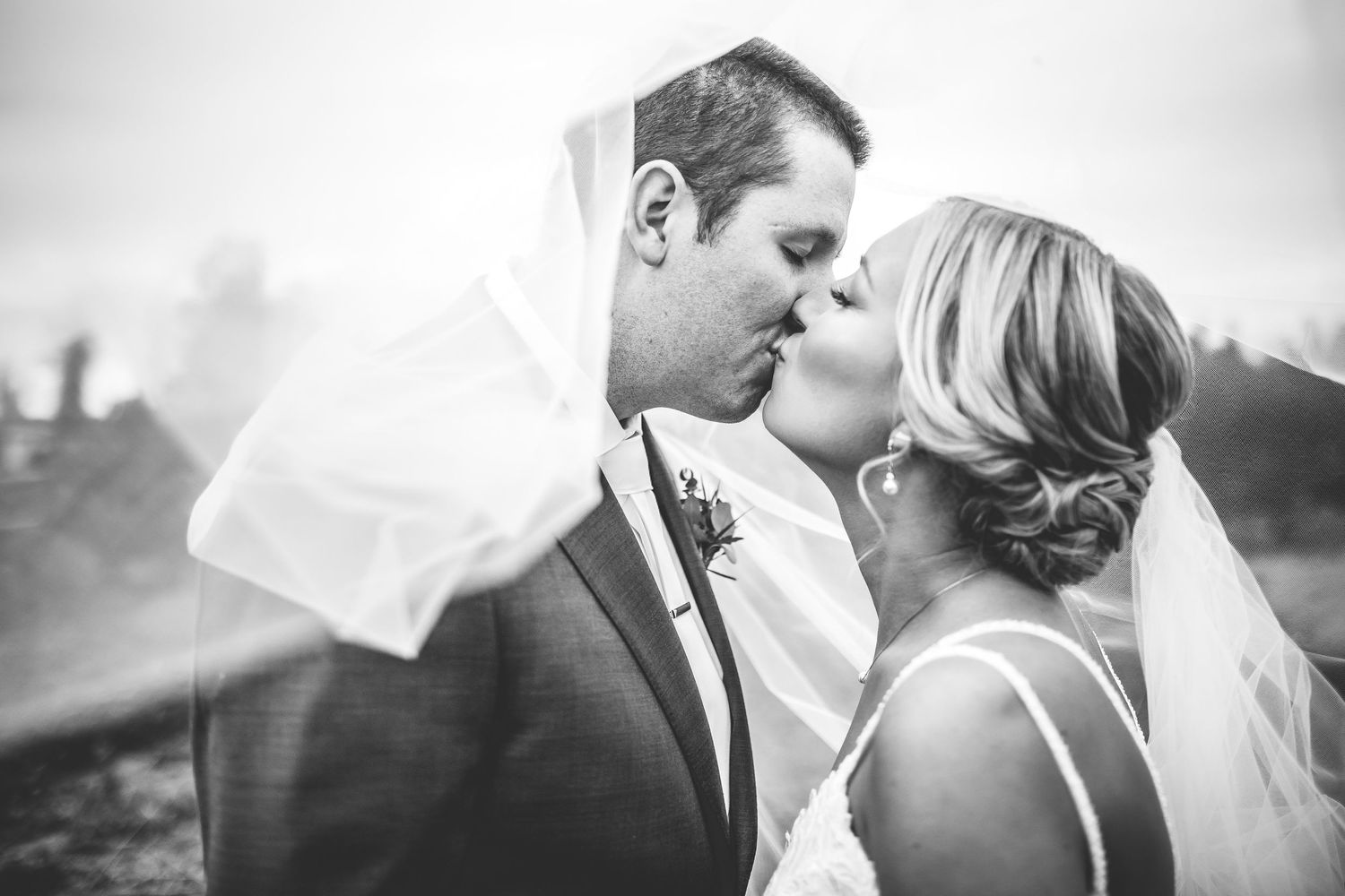 Black and white intimate wedding portraits showcase tender moments between newlyweds.