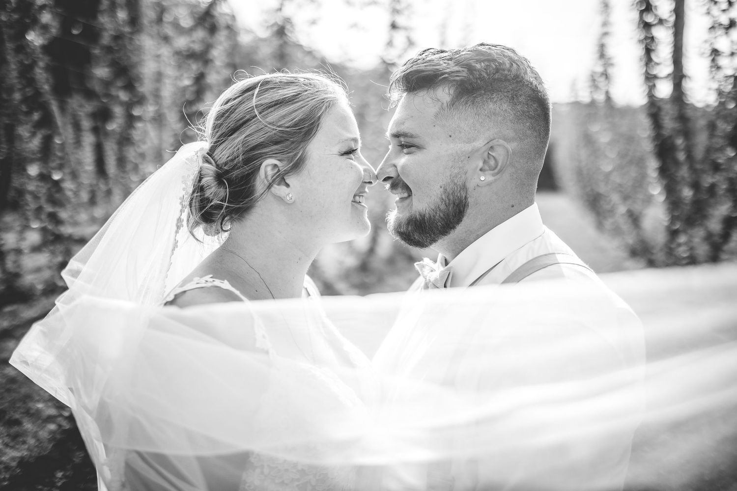 Artistic black and white wedding photography sequence with flowing veil movement.