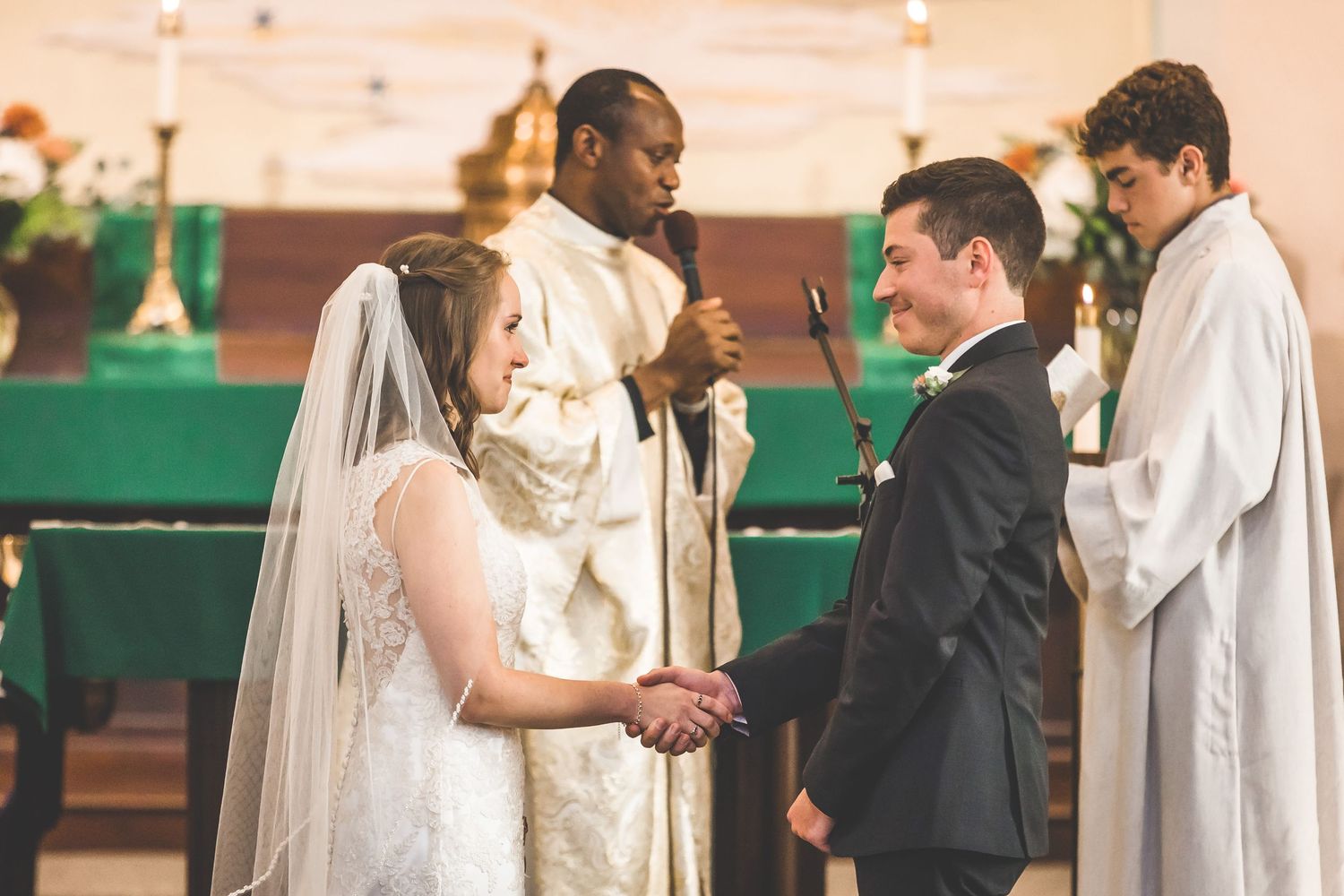 Traditional church wedding ceremony with couple exchanging vows at the altar.