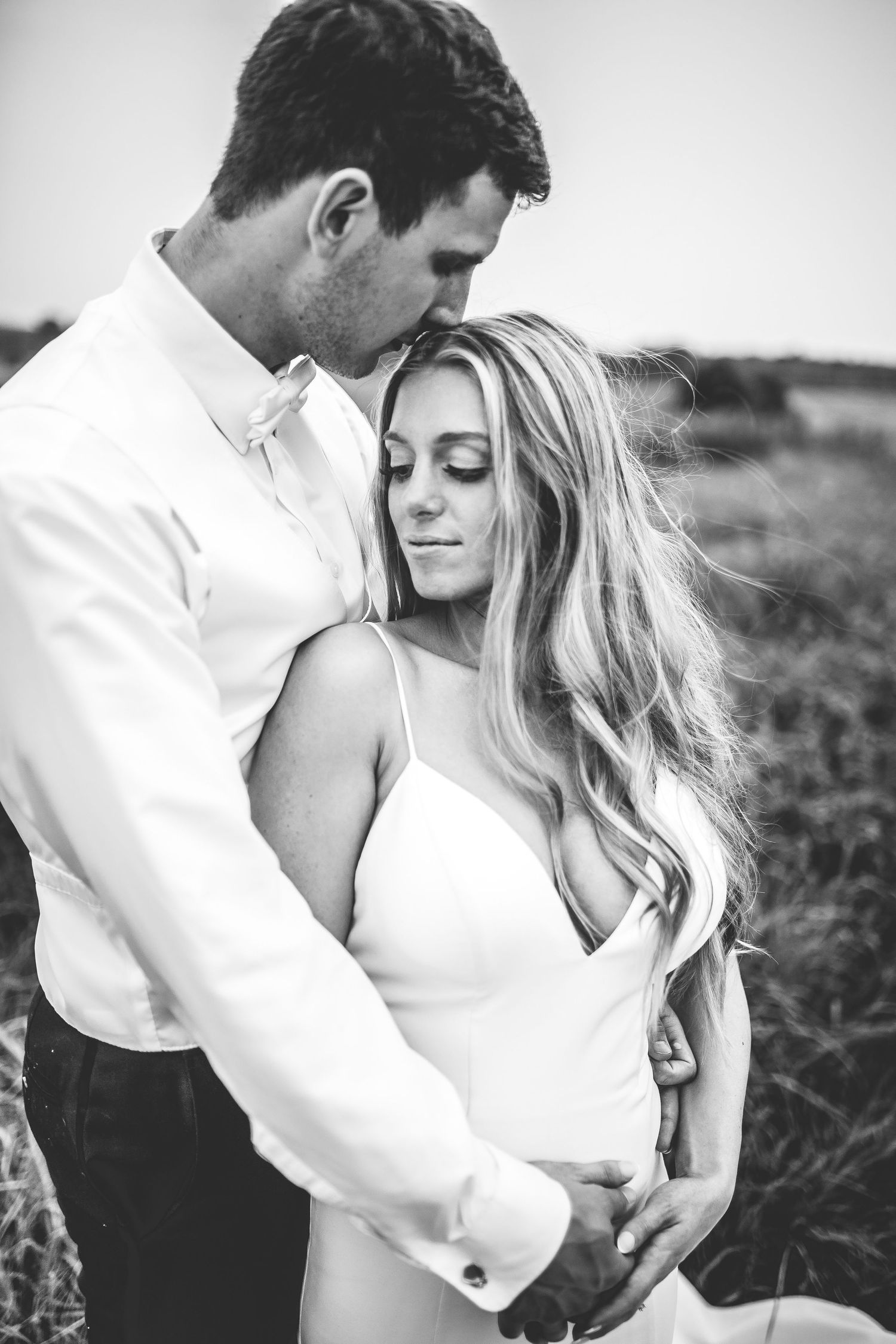 Artistic black and white close-up of newlyweds sharing an intimate moment.