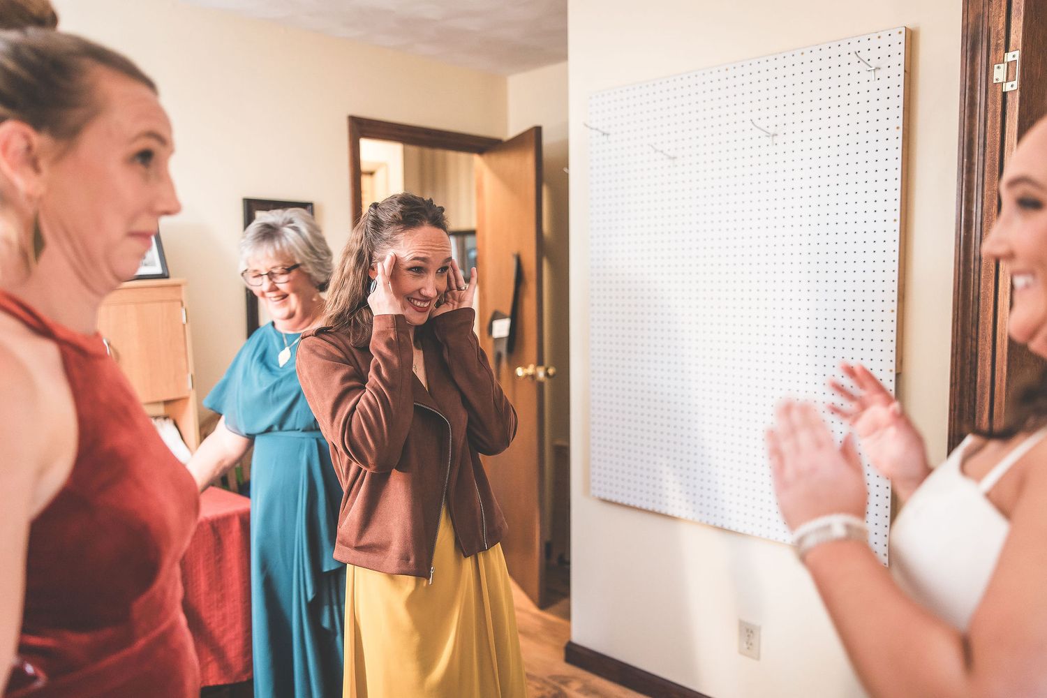 Multiple shots showing joyful reactions during wedding day preparations.