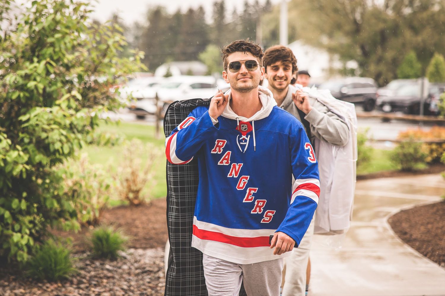 Casual outdoor photo session featuring New York Rangers hockey jerseys.