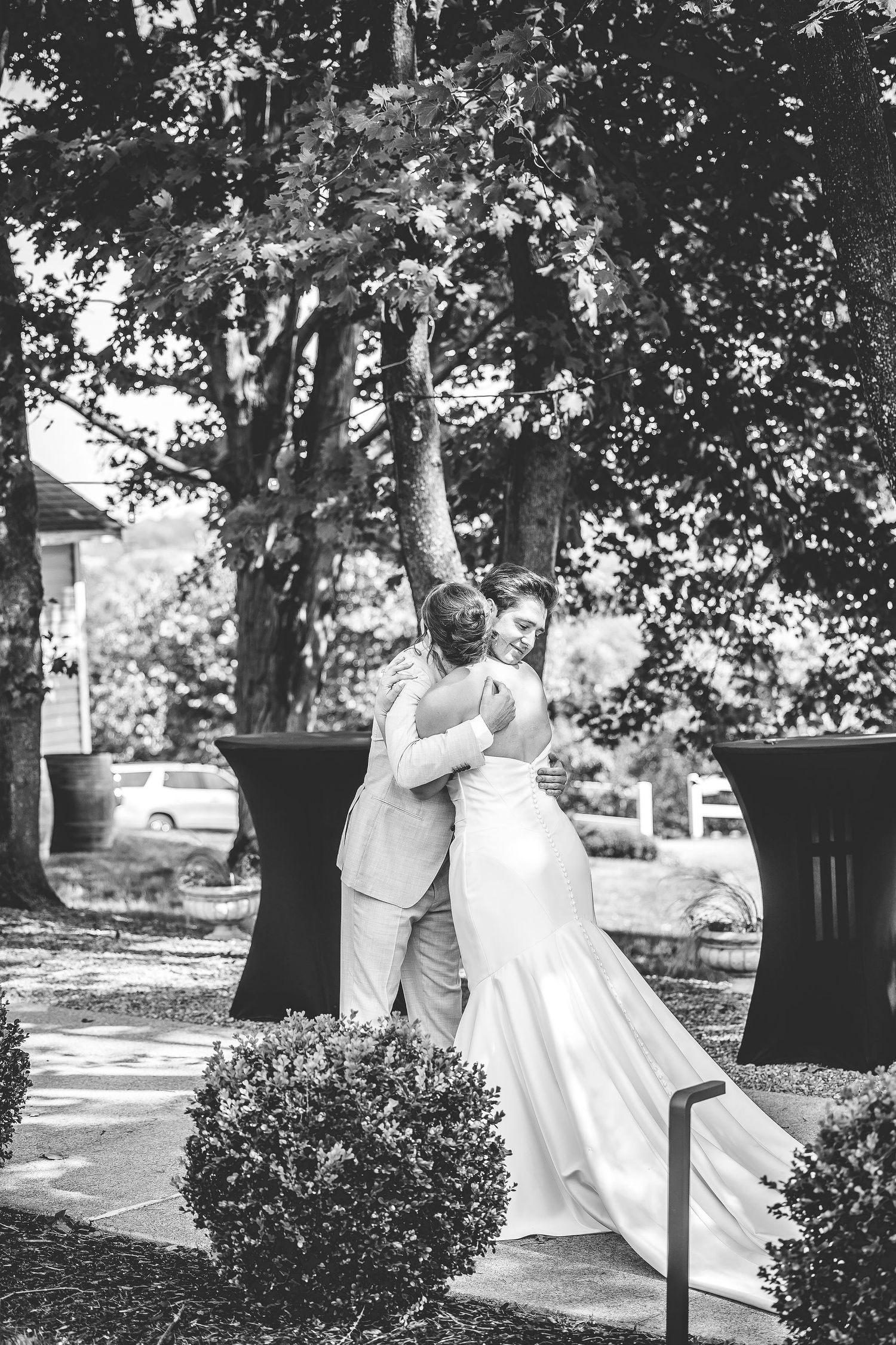 A romantic wedding first look moment captured in a series of photos under sunlit trees.