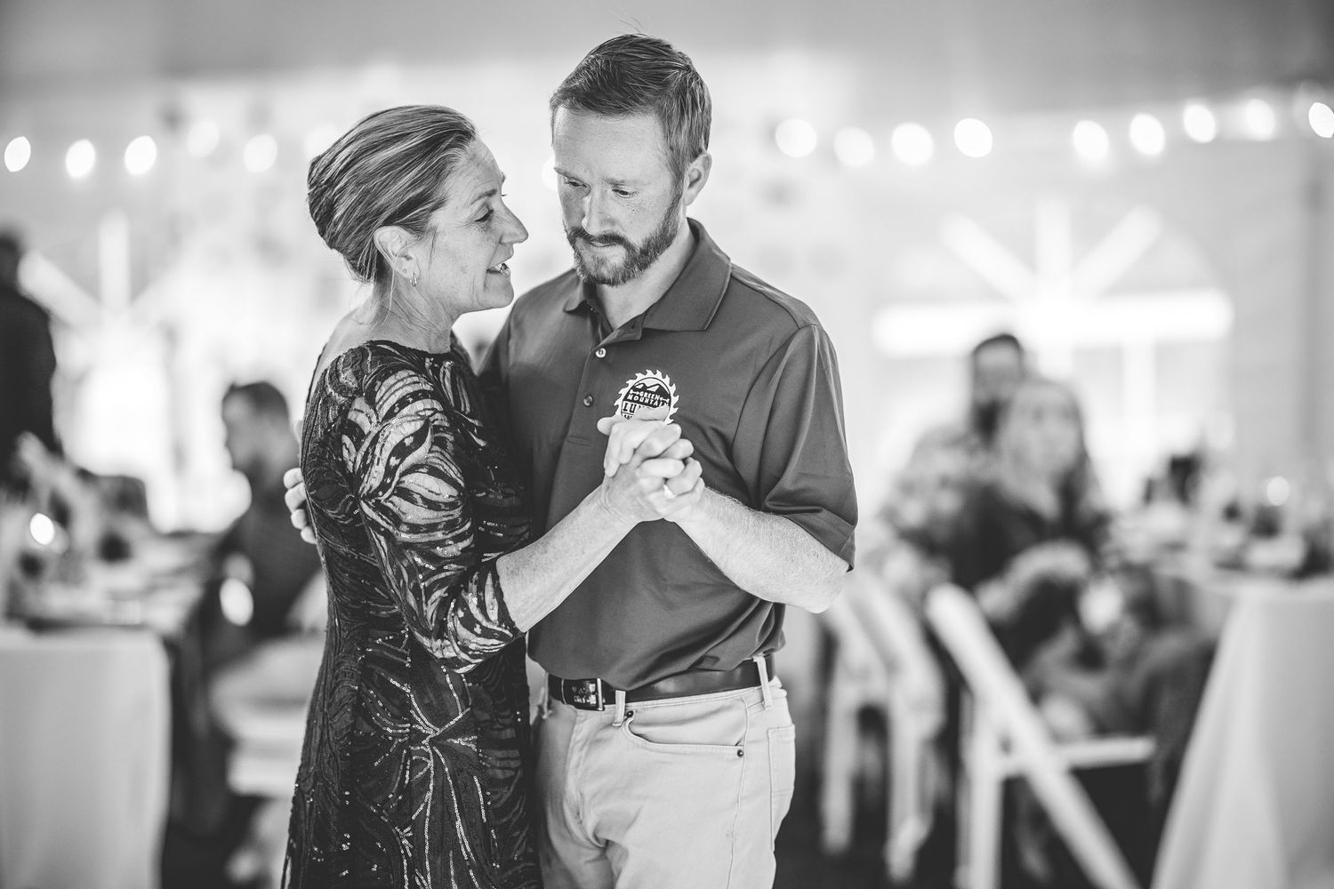 Intimate dance moments captured in black and white at an evening wedding celebration.