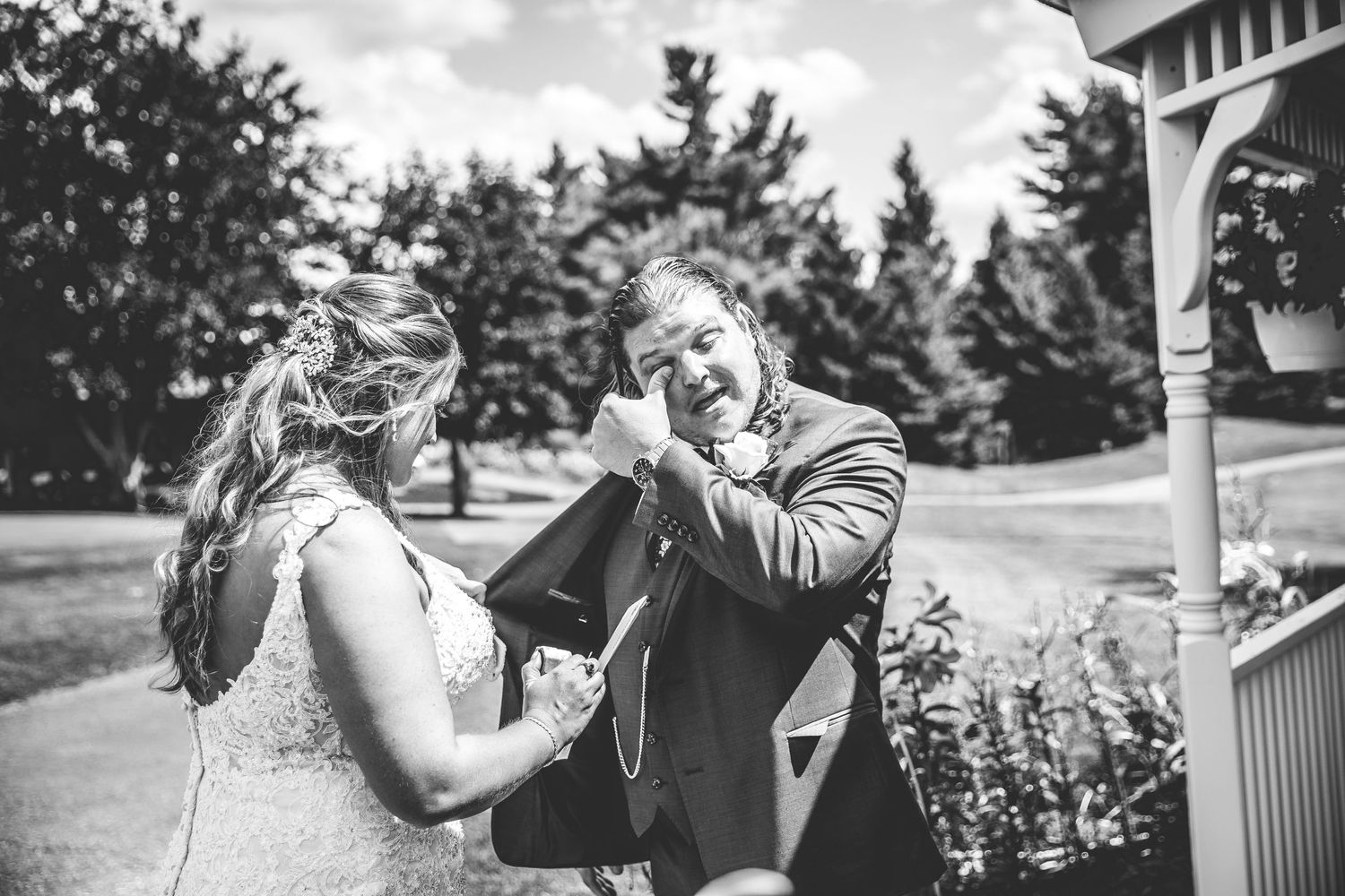 Candid wedding photography capturing couple's joyful first look reaction.