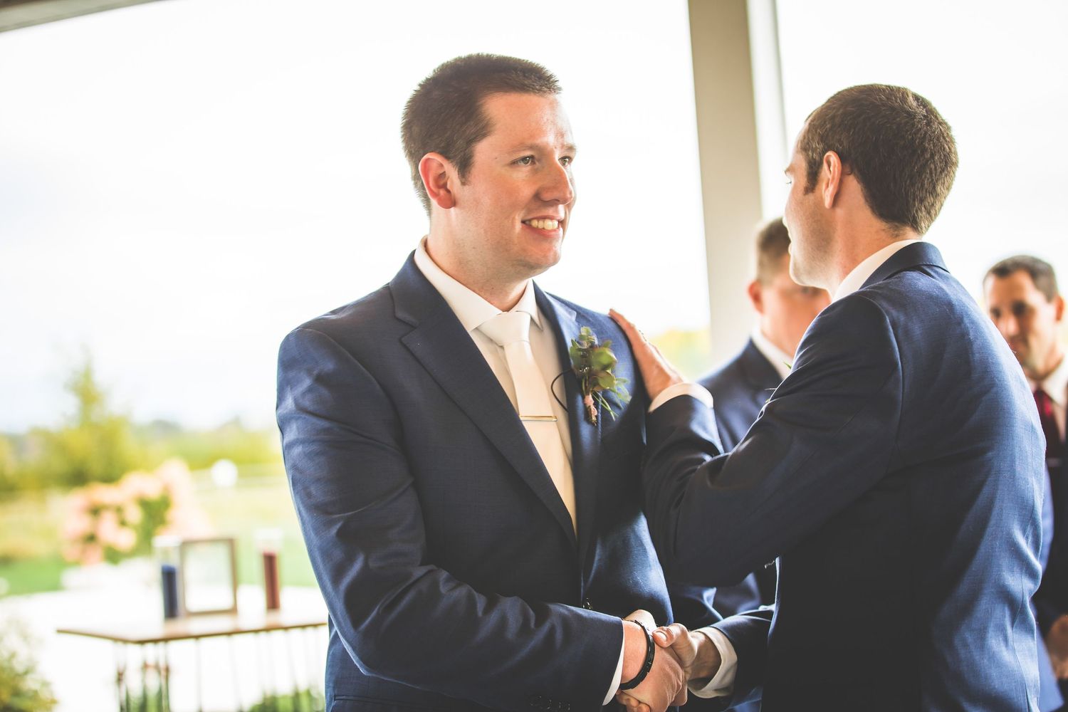 Groomsmen share laughs and conversations before the ceremony.
