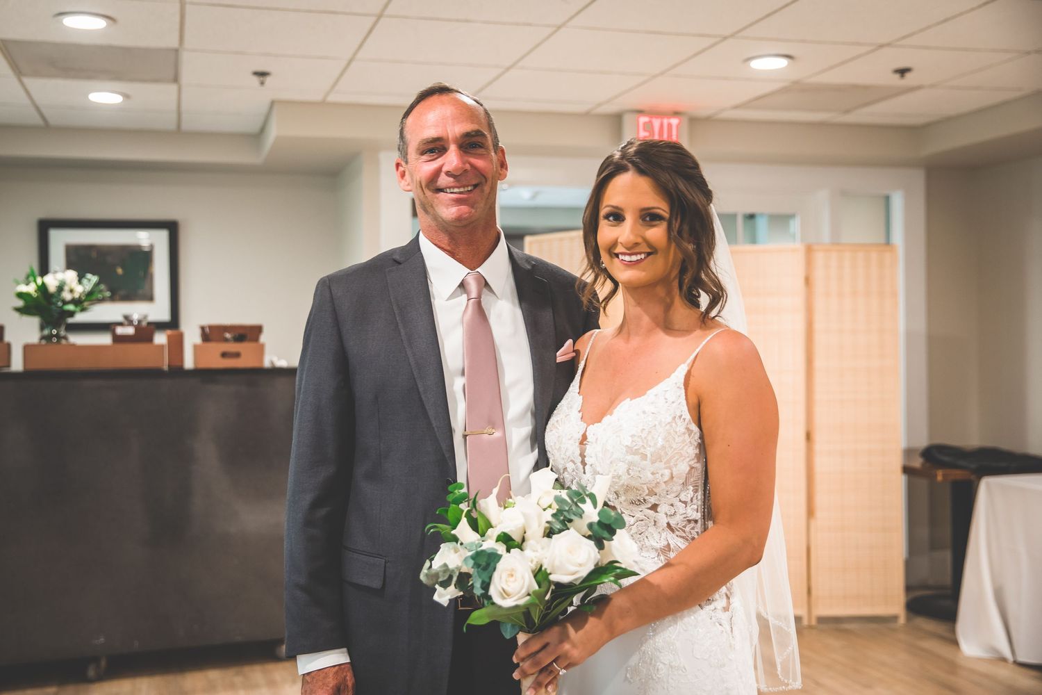Candid moments from a wedding celebration showing joyful interactions in an indoor venue.